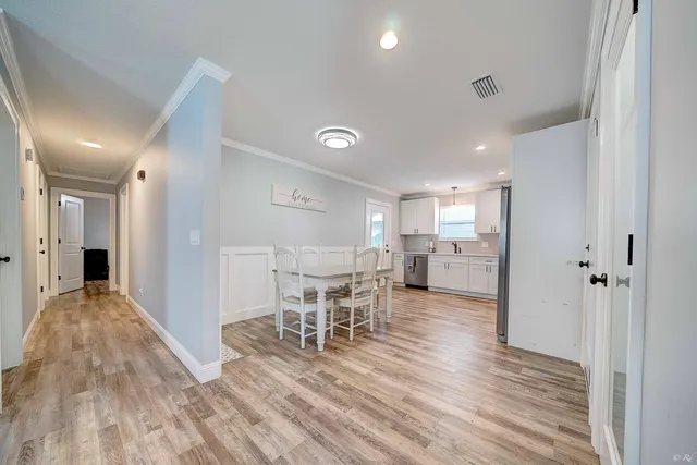 a view of a kitchen and dining room