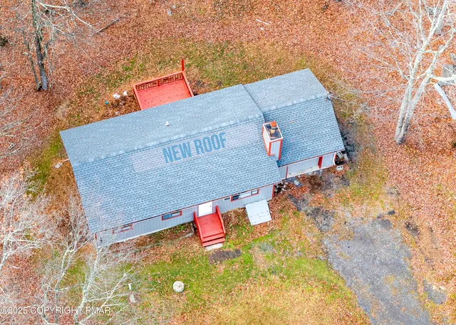 a pathway of a house with backyard