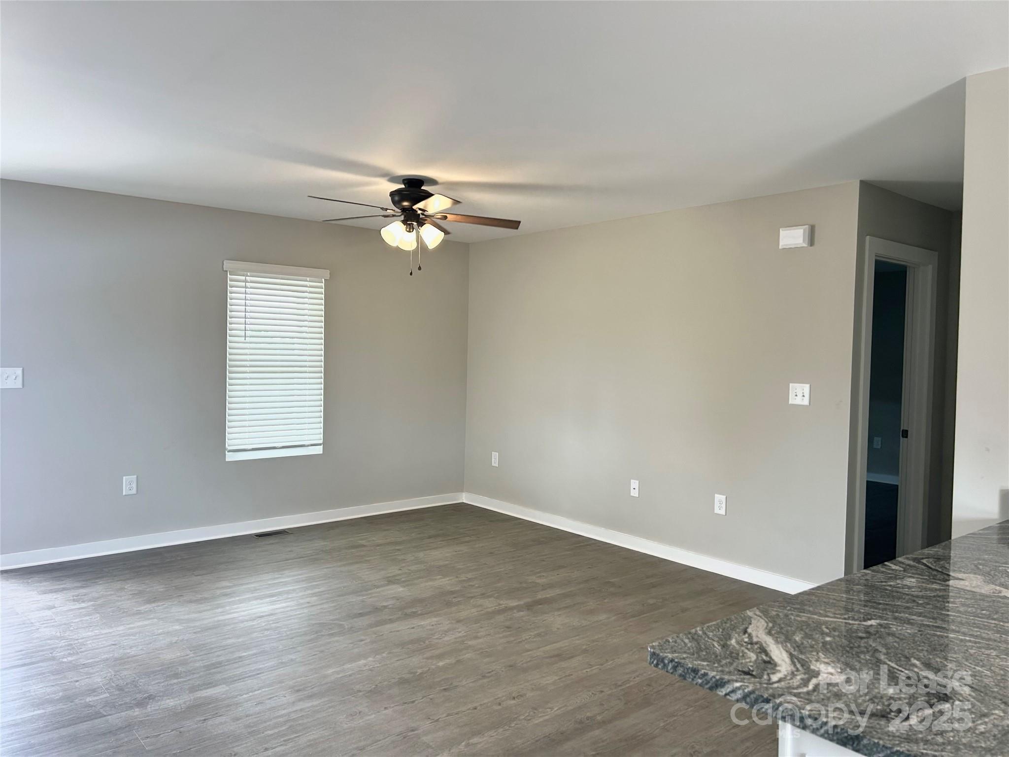 3291 Paul Elmore Road Lincolnton, NC 28092 - Photo 4 of 17 wooden floor in an empty room with a window