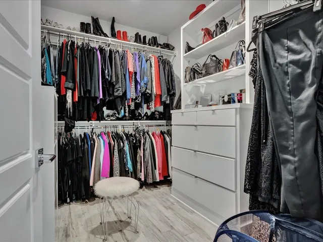 a bathroom with a bathtub and a window