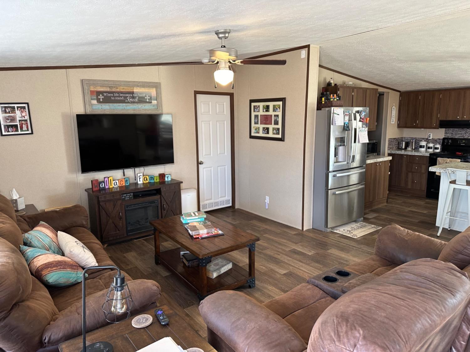 760 Highway 82 Ralls, TX 79357 - Photo 12 of 25 a living room with furniture and a flat screen tv