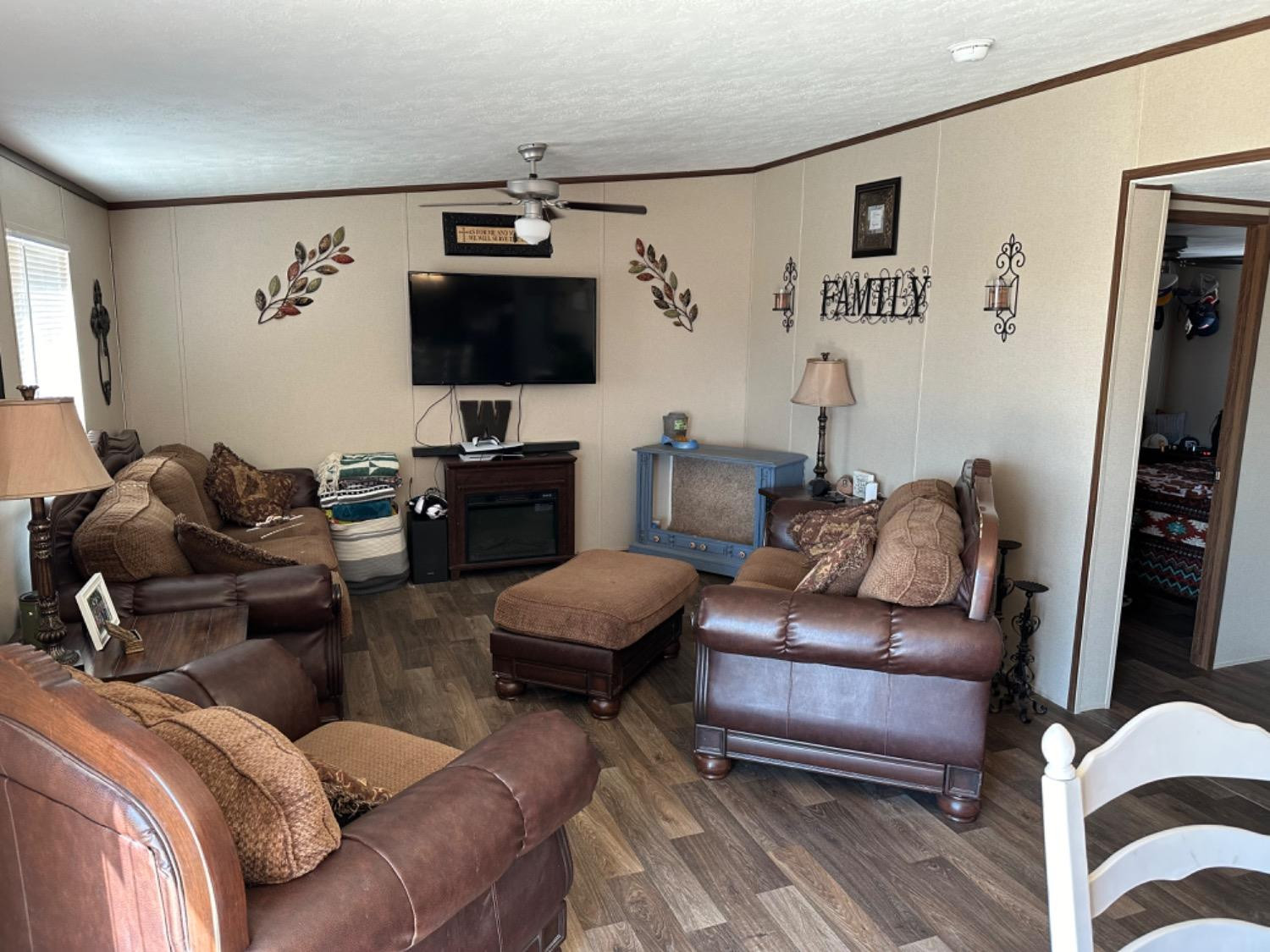 760 Highway 82 Ralls, TX 79357 - Photo 7 of 25 a living room with furniture and a flat screen tv