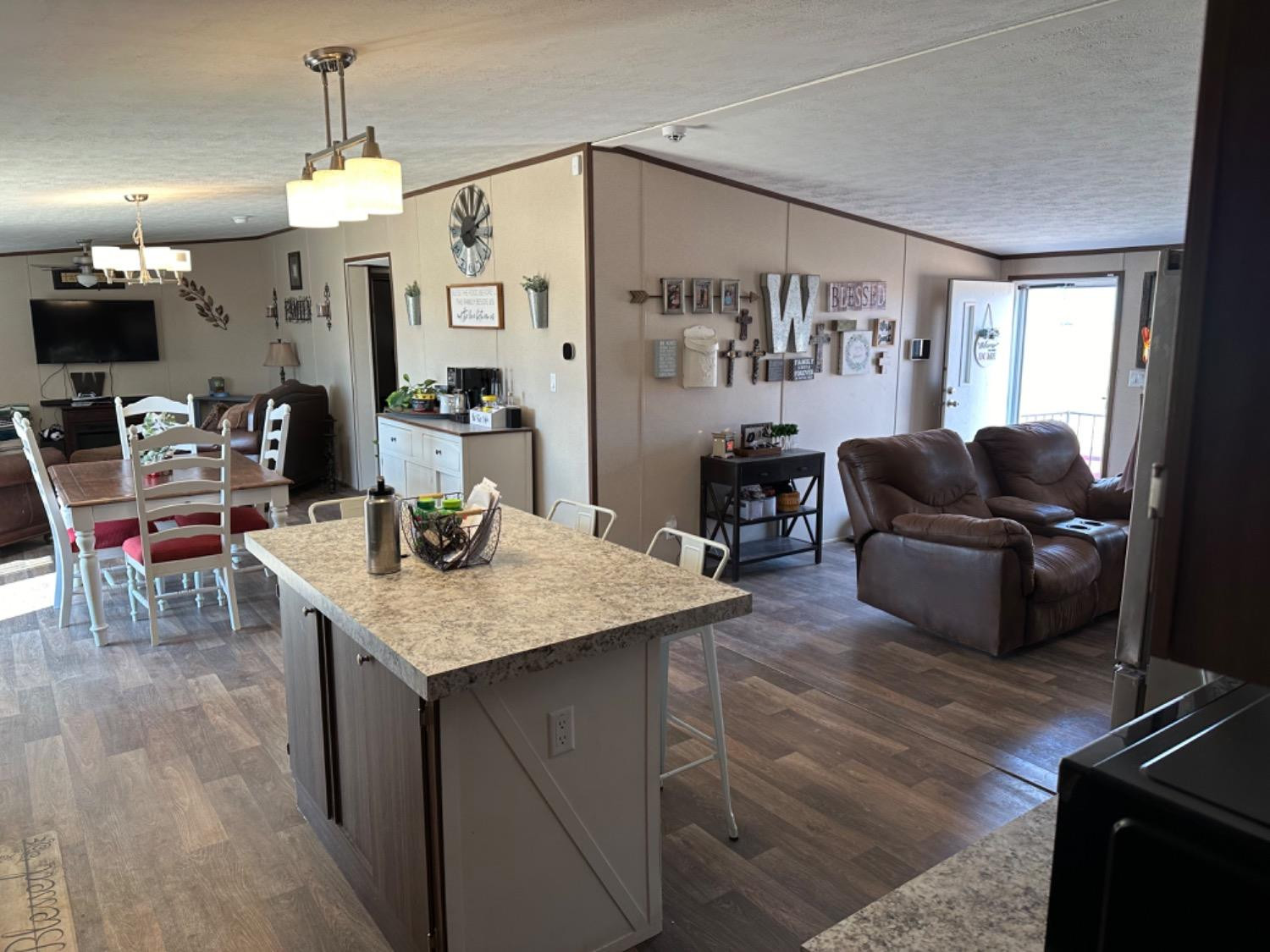760 Highway 82 Ralls, TX 79357 - Photo 10 of 25 a living room with furniture and a flat screen tv