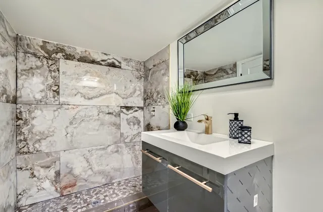 a bathroom with a sink and a mirror