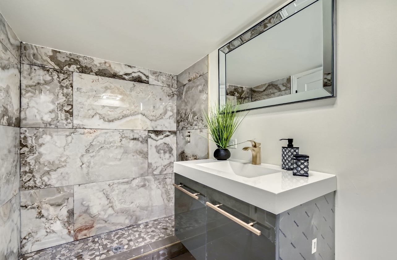 15019 Evers Street Dolton, IL 60419 - Photo 5 of 8 a bathroom with a sink and a mirror