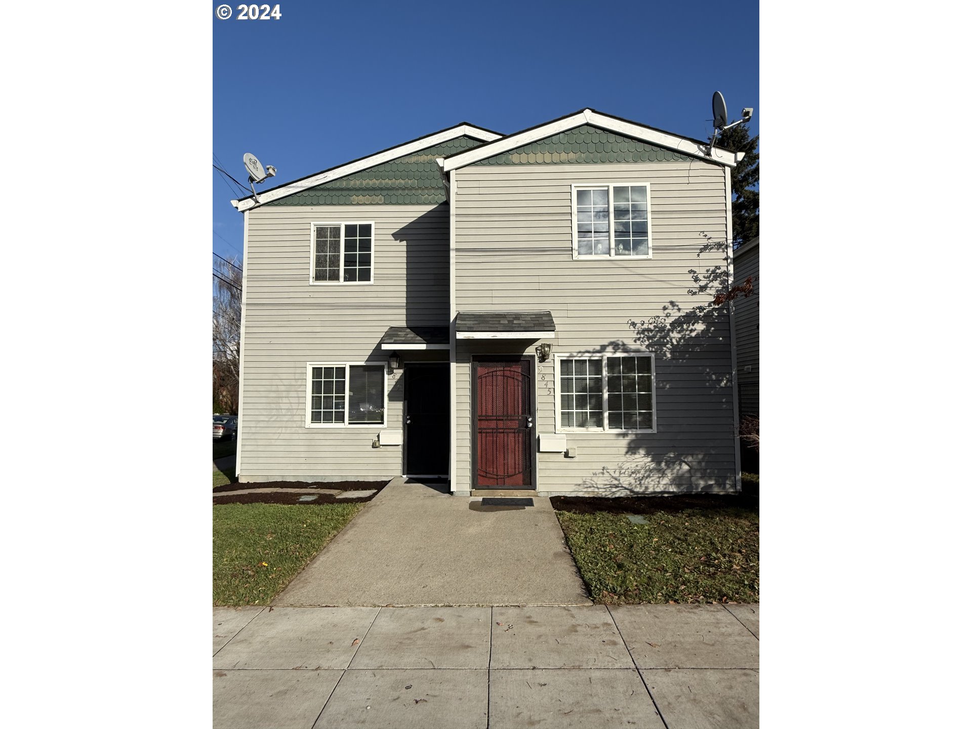 a front view of a house with a yard