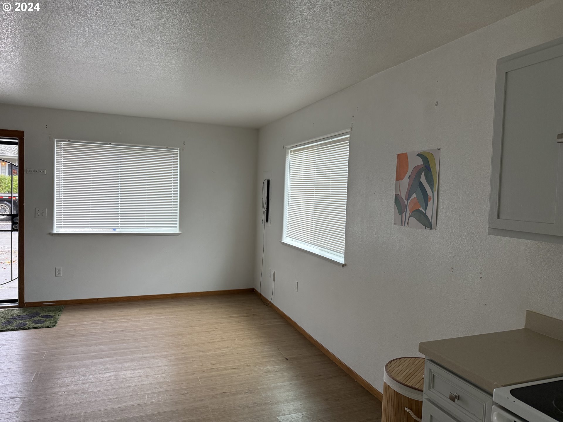 9845 North Lombard Street Portland, OR 97203 - Photo 12 of 35 a view of room with hardwood floor and window