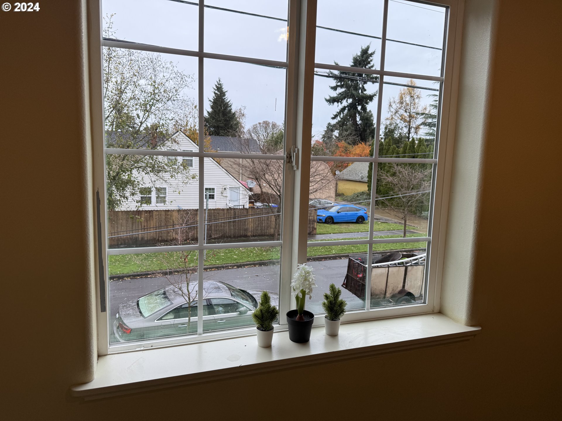 9845 North Lombard Street Portland, OR 97203 - Photo 17 of 35 a view of a room with window and wooden floor