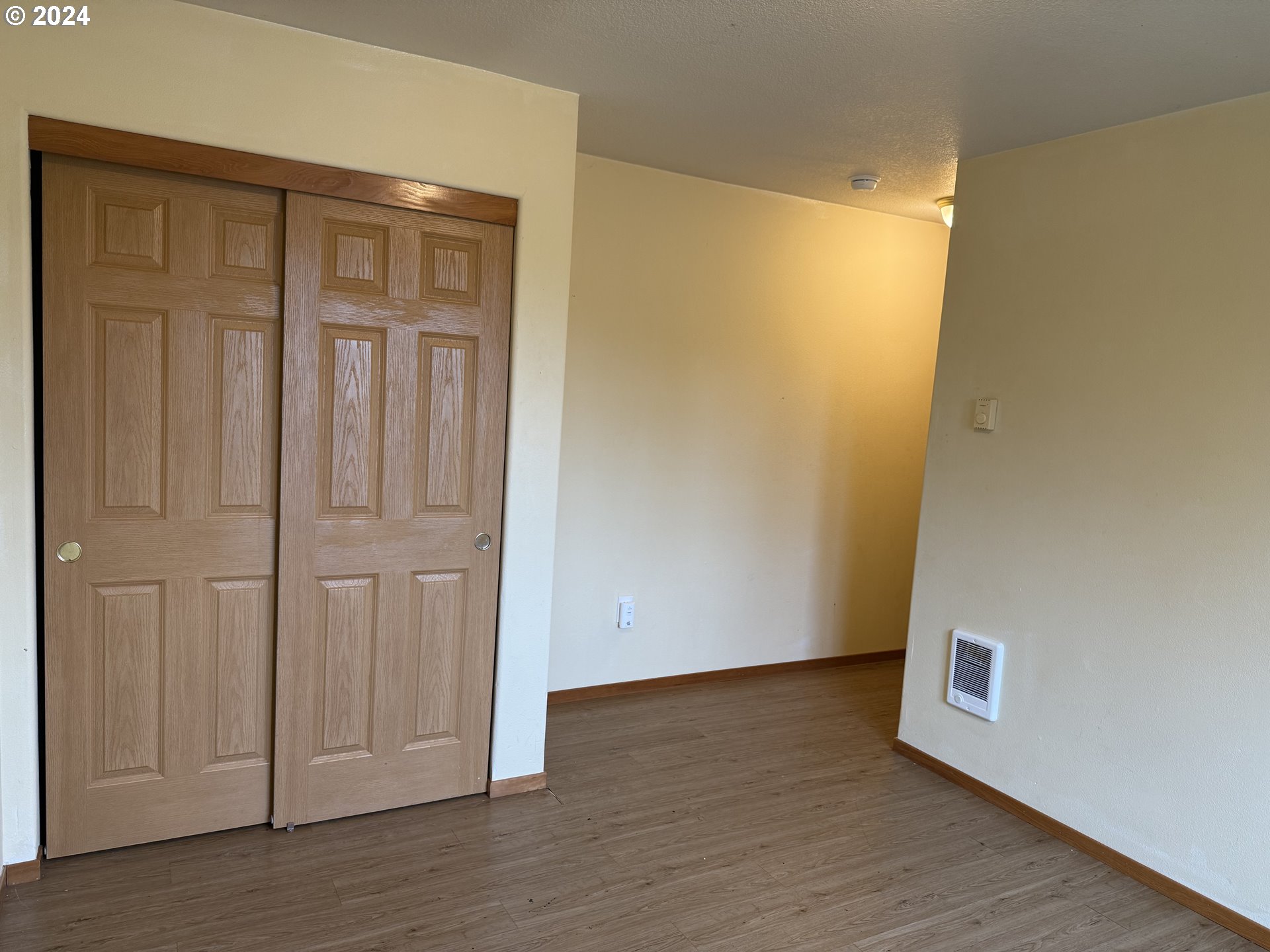 9845 North Lombard Street Portland, OR 97203 - Photo 18 of 35 a view of an empty room with wooden floor