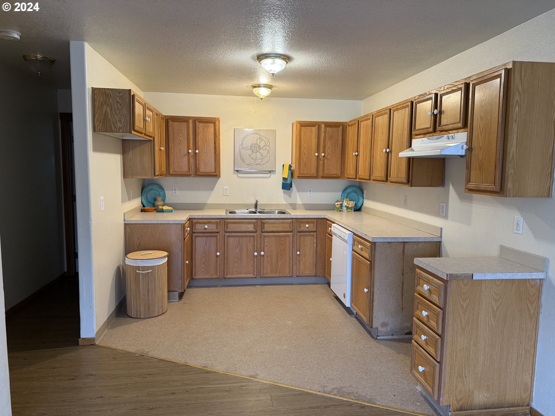 9845 North Lombard Street Portland, OR 97203 - Photo 21 of 35 a kitchen with a white stove top oven sink and cabinets