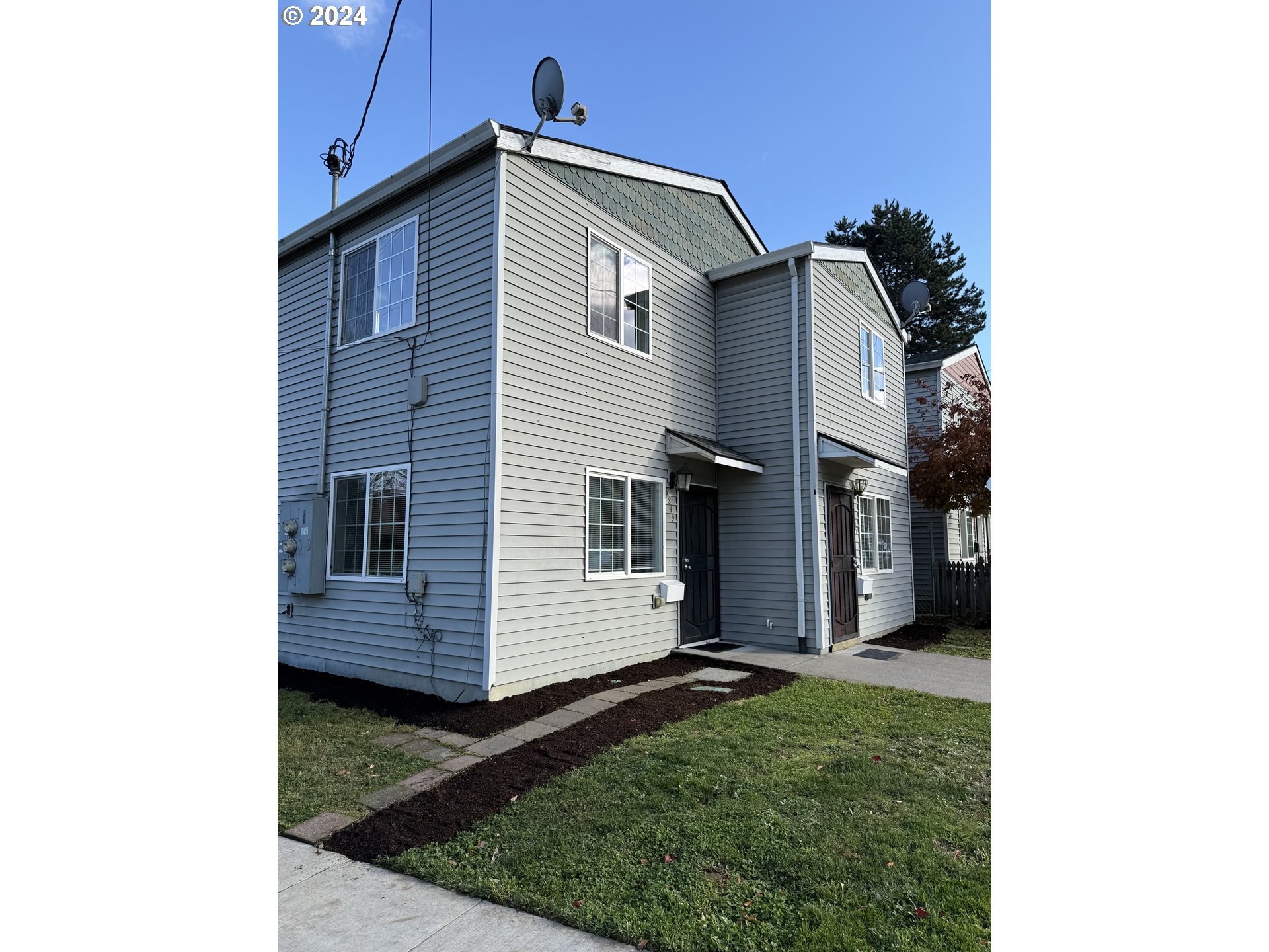 9845 North Lombard Street Portland, OR 97203 - Photo 3 of 35 a view of a house with a backyard