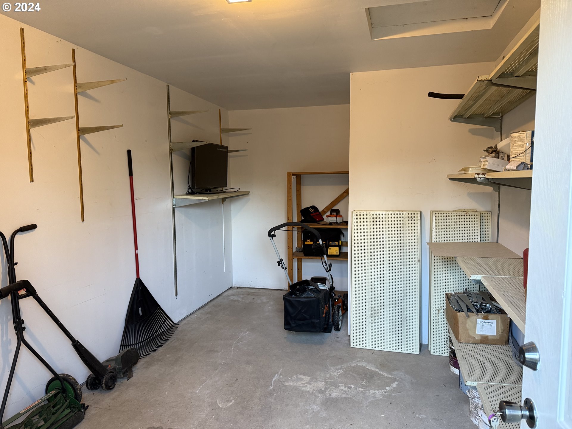 9845 North Lombard Street Portland, OR 97203 - Photo 32 of 35 a view of walk in closet with clothes and shoes