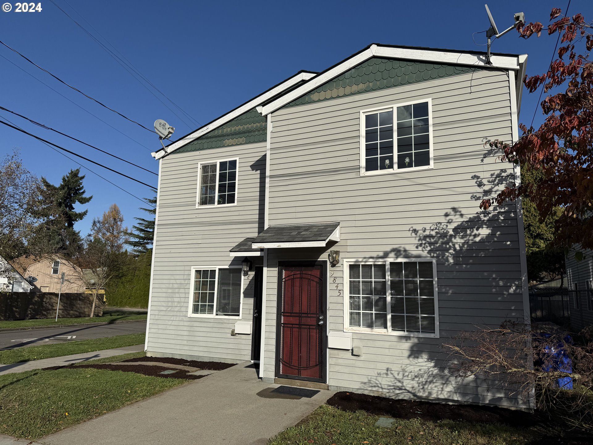 9845 North Lombard Street Portland, OR 97203 - Photo 33 of 35 a front view of a house with a yard