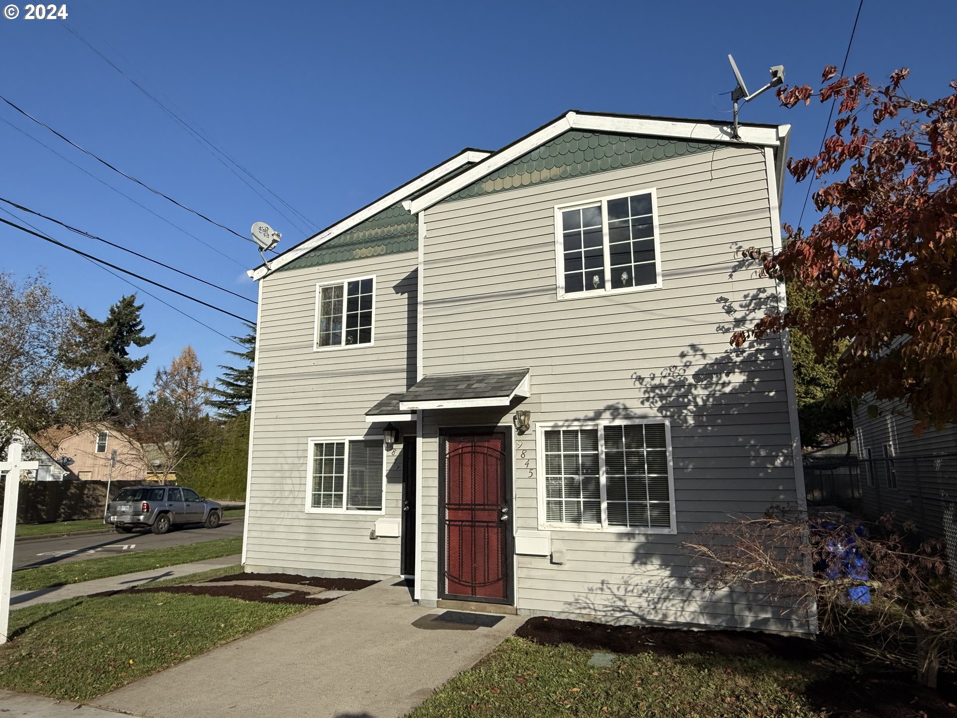 9845 North Lombard Street Portland, OR 97203 - Photo 35 of 35 a front view of a house with a yard