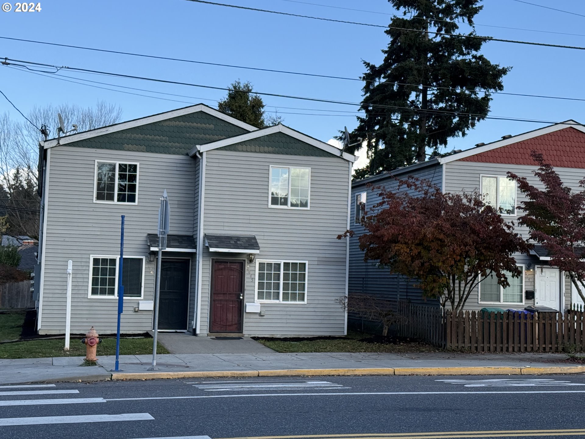 9845 North Lombard Street Portland, OR 97203 - Photo 6 of 35 a house that has a tree in front of it