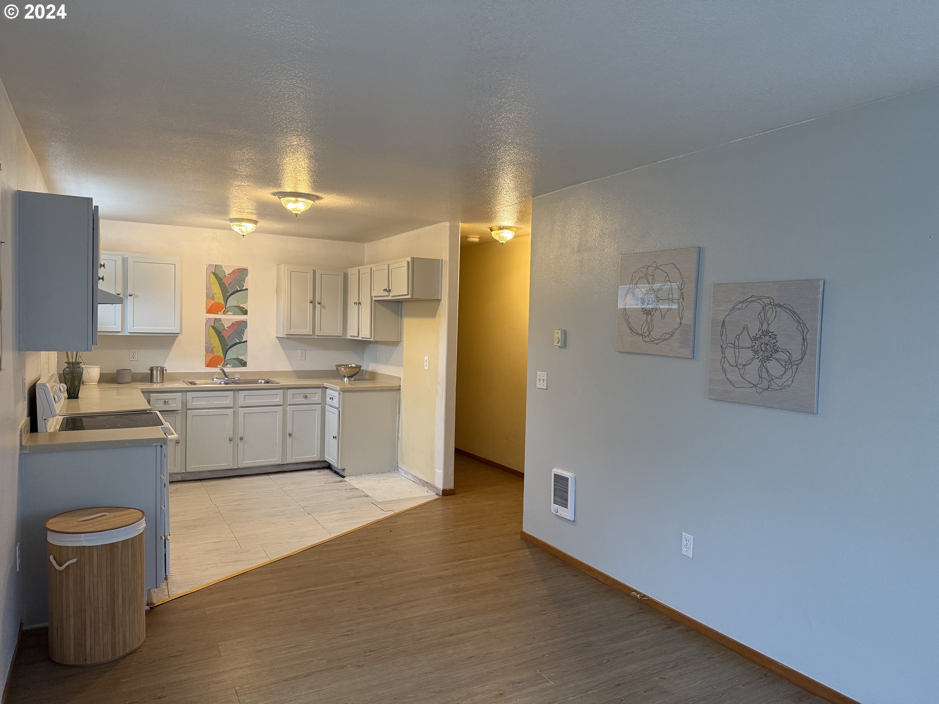 9845 North Lombard Street Portland, OR 97203 - Photo 8 of 35 a kitchen with a refrigerator and a sink