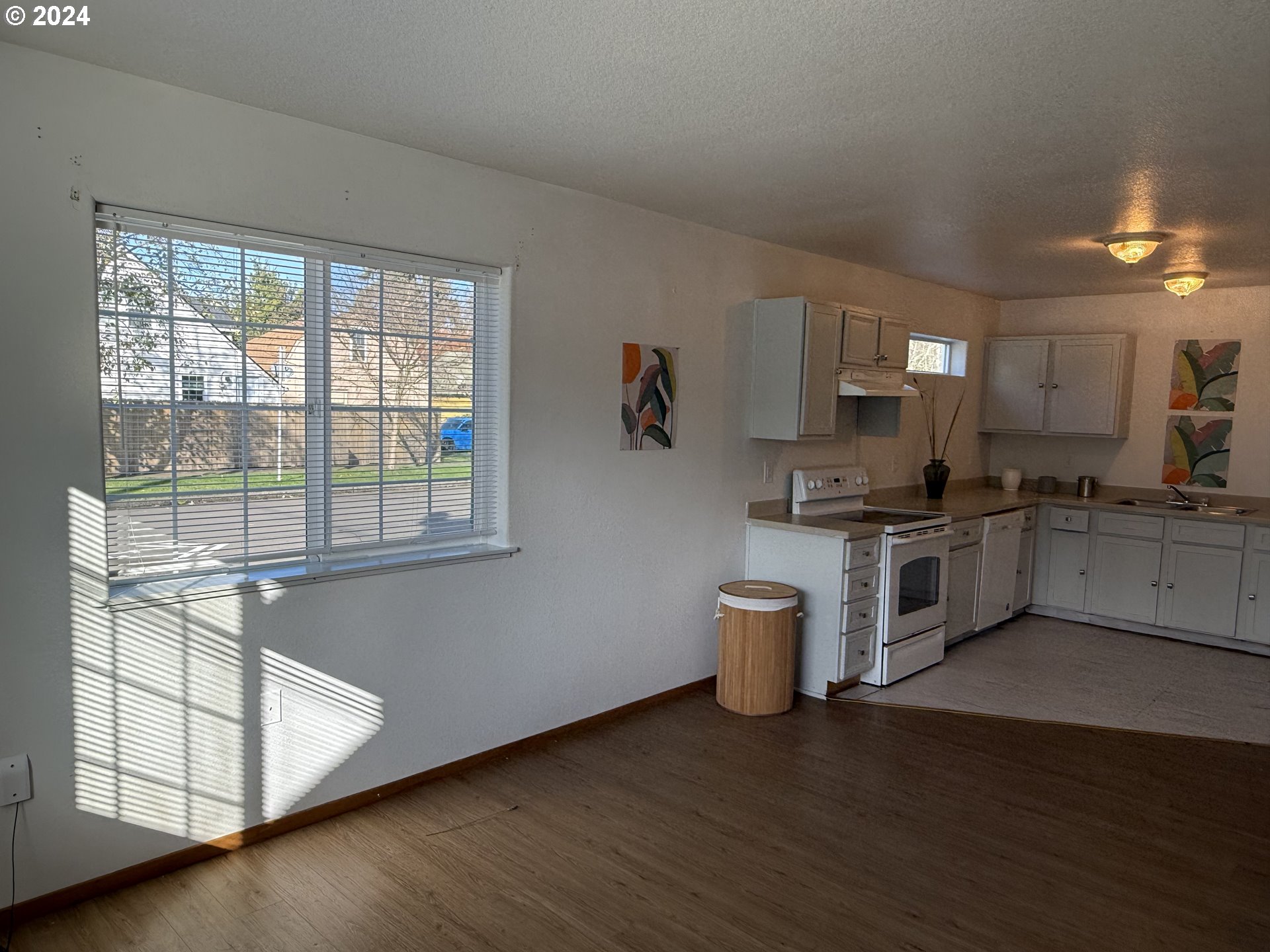 9845 North Lombard Street Portland, OR 97203 - Photo 9 of 35 a kitchen with a refrigerator and a stove top oven