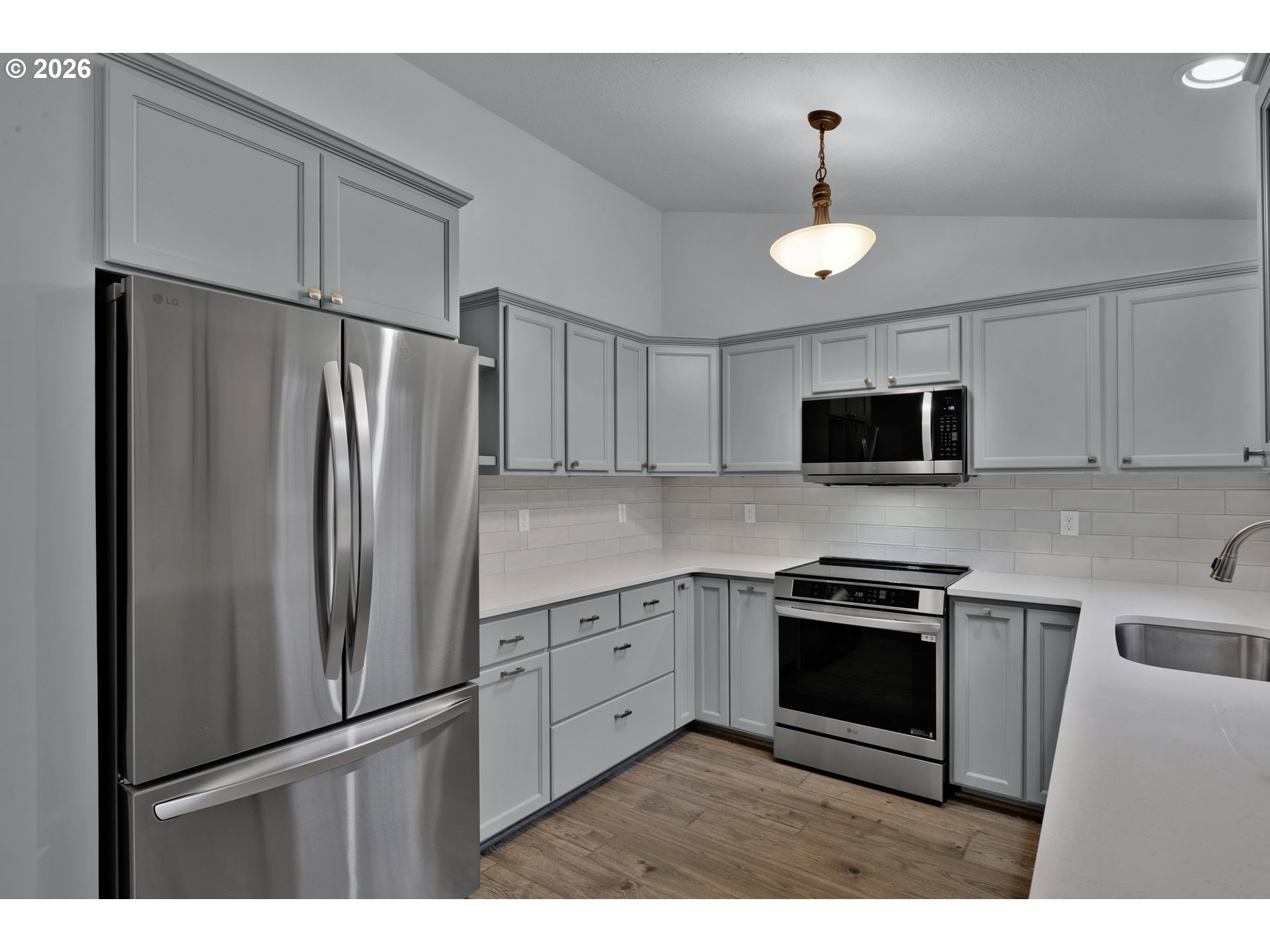 340 54th Street Springfield, OR 97478 - Photo 11 of 33 a kitchen with stainless steel appliances granite countertop a refrigerator a stove a sink and a microwave
