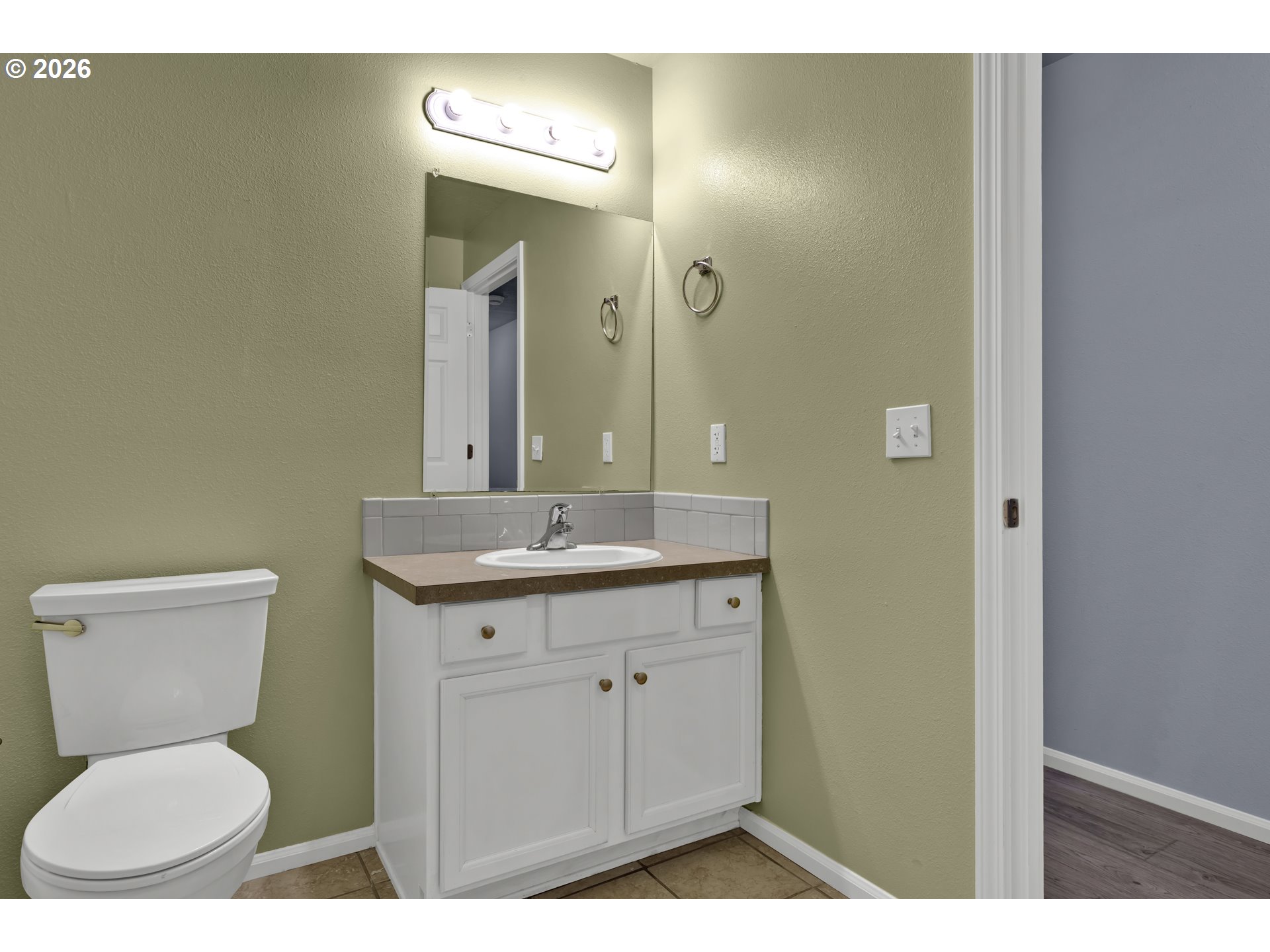 340 54th Street Springfield, OR 97478 - Photo 18 of 33 a bathroom with a toilet a sink and mirror