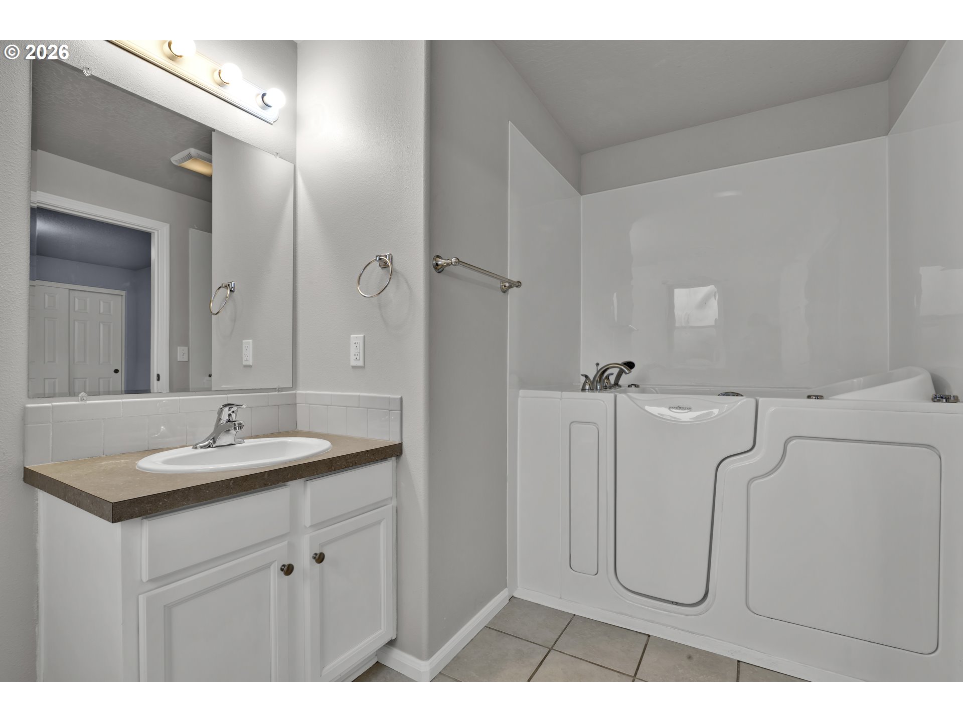 340 54th Street Springfield, OR 97478 - Photo 25 of 33 a bathroom with a granite countertop sink a mirror and a shower