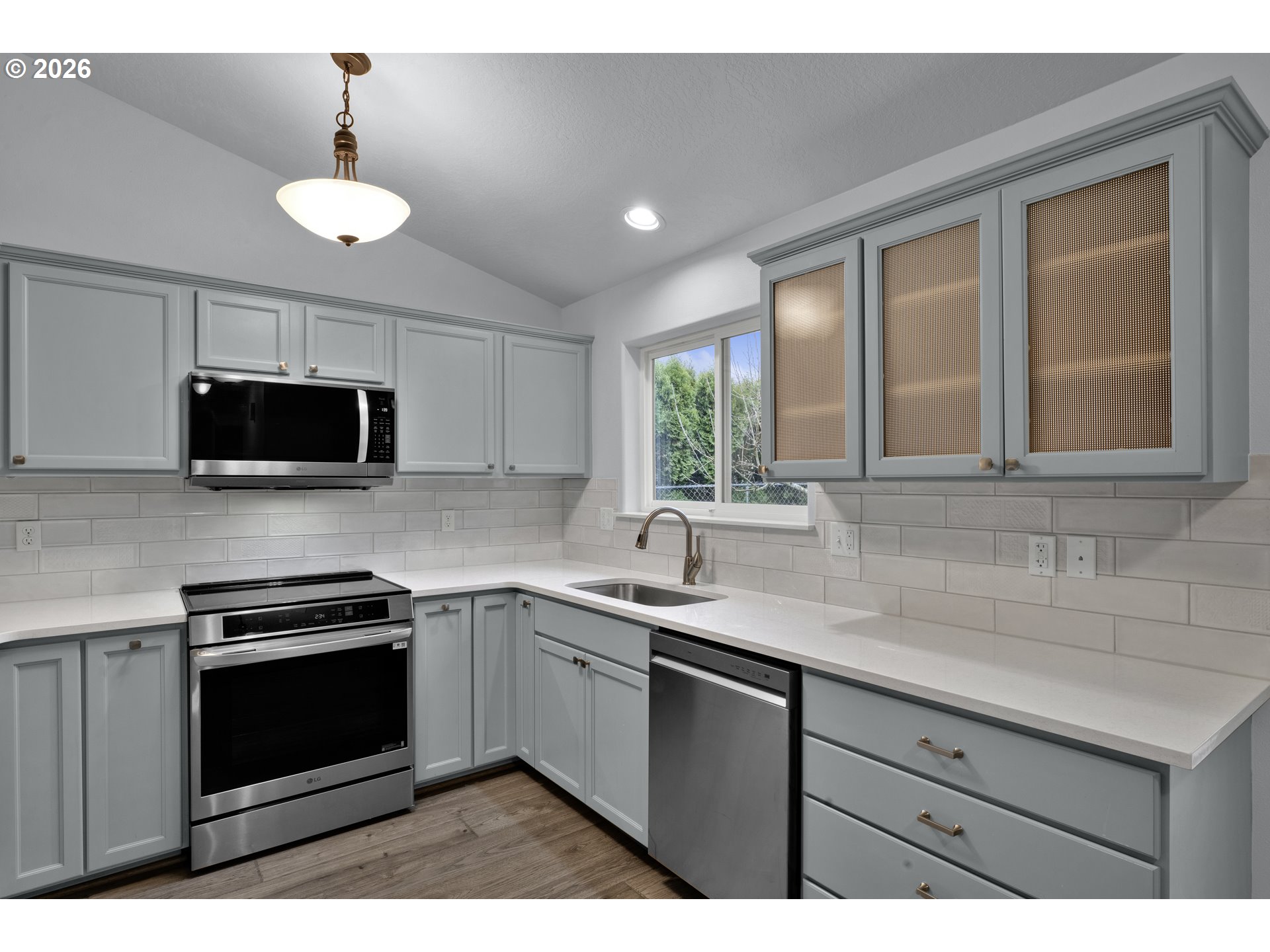 340 54th Street Springfield, OR 97478 - Photo 9 of 33 a kitchen with stainless steel appliances granite countertop a sink and a microwave
