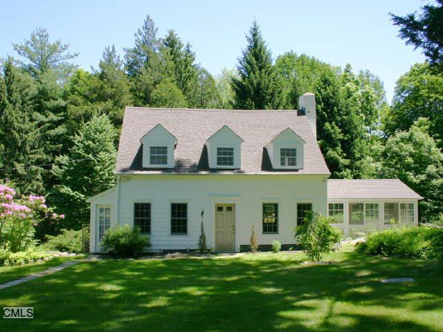 95 Ladder Hill Road North Weston, CT 06883 - Photo 1 of 1 a front view of a house with a yard table and chairs