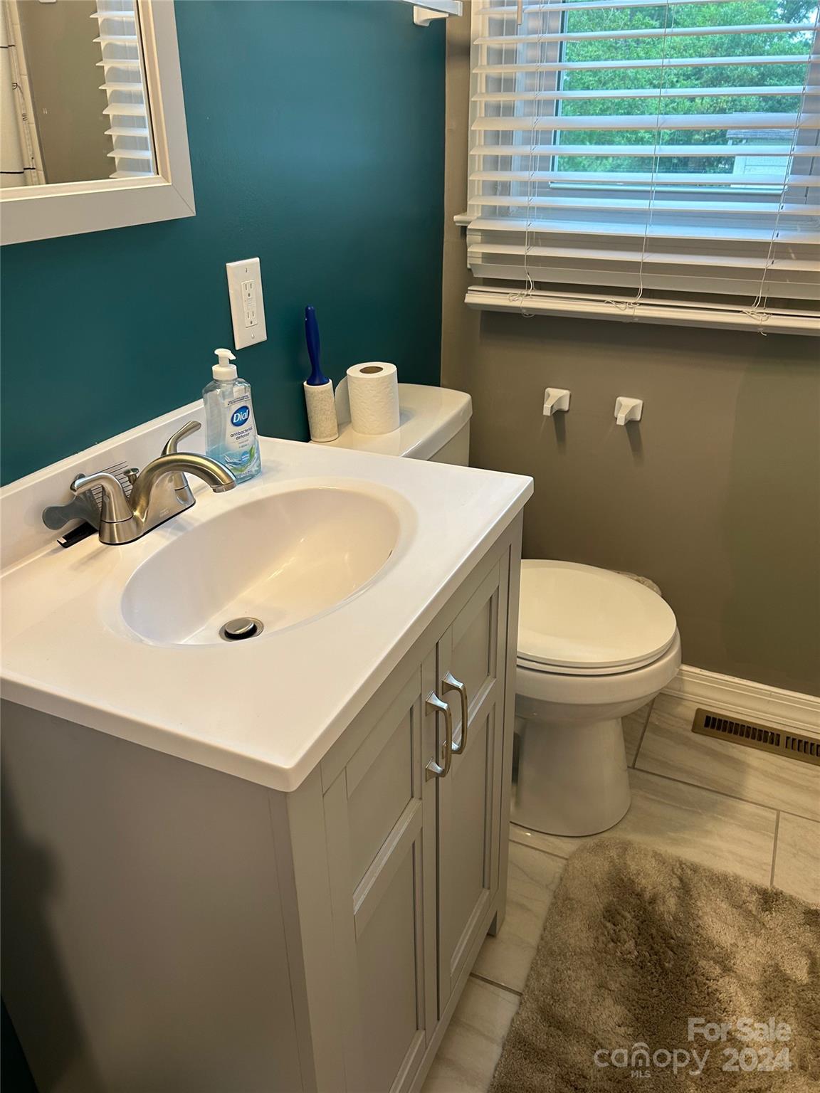 710 Union Cemetery Road Southwest Concord, NC 28027 - Photo 14 of 30 a bathroom with a sink and a toilet