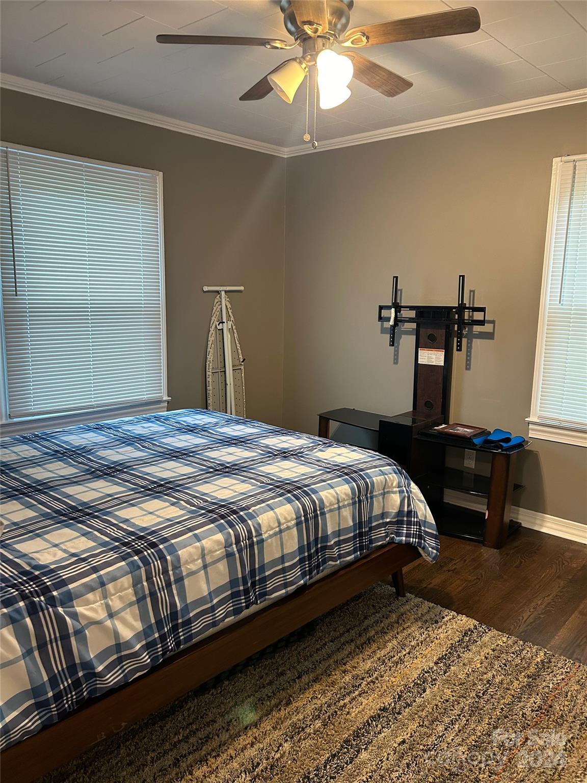710 Union Cemetery Road Southwest Concord, NC 28027 - Photo 17 of 30 a bedroom with a bed and lamp with window