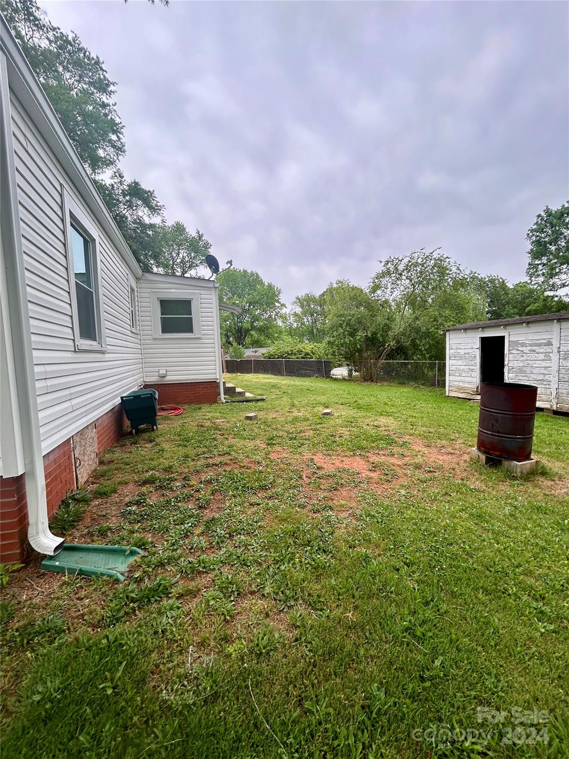 710 Union Cemetery Road Southwest Concord, NC 28027 - Photo 25 of 30 a backyard of a house with lots of green space