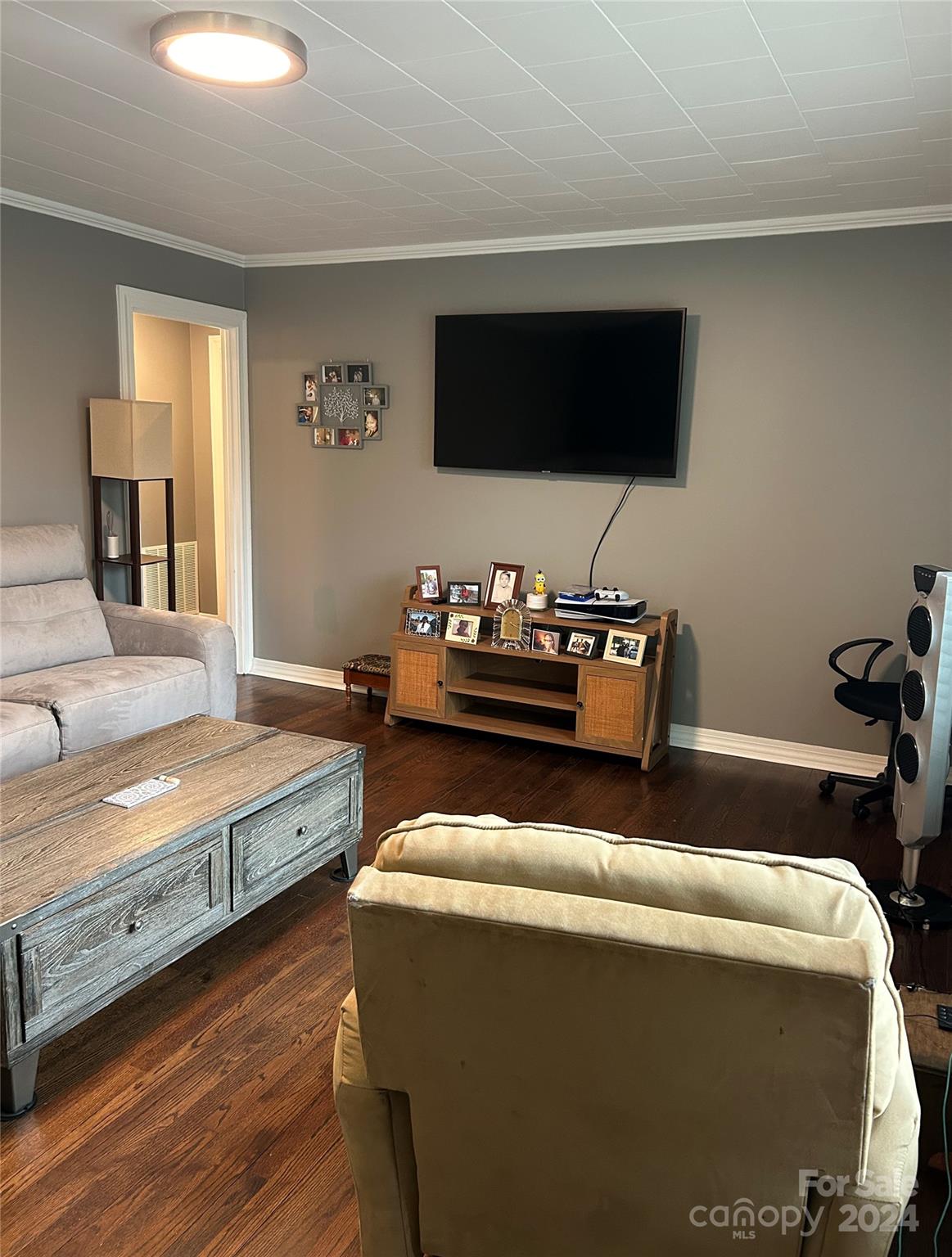 710 Union Cemetery Road Southwest Concord, NC 28027 - Photo 4 of 30 a living room with furniture and a flat screen tv