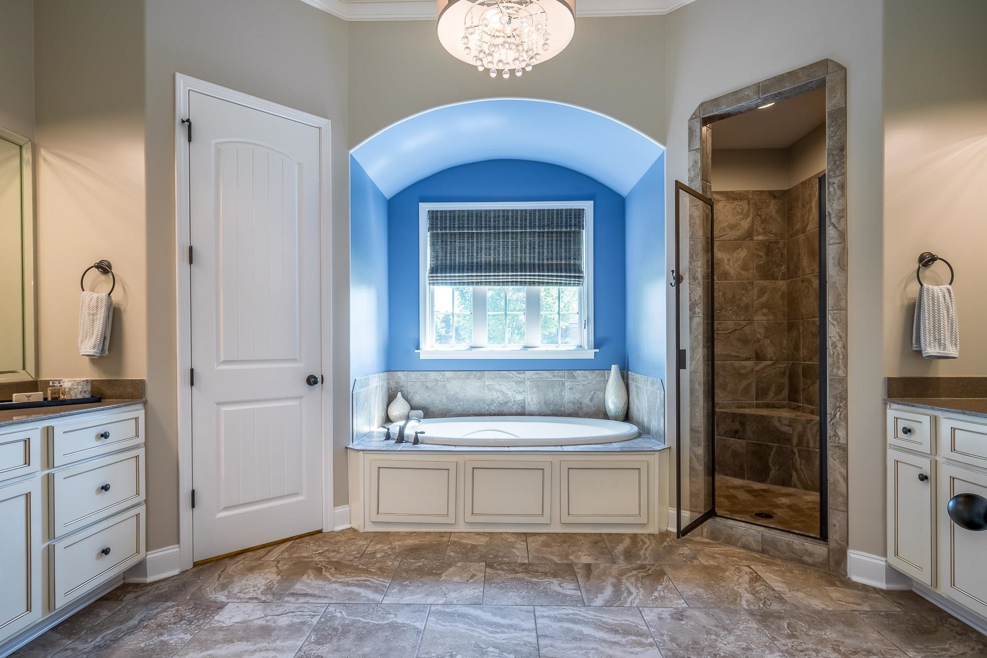 1347 Conser Street Collierville, TN 38017 - Photo 11 of 25 a spacious bathroom with a tub sink and mirror