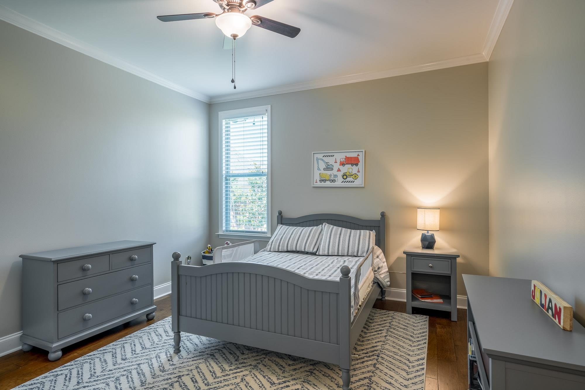 1347 Conser Street Collierville, TN 38017 - Photo 12 of 25 a bedroom with a bed and a chandelier