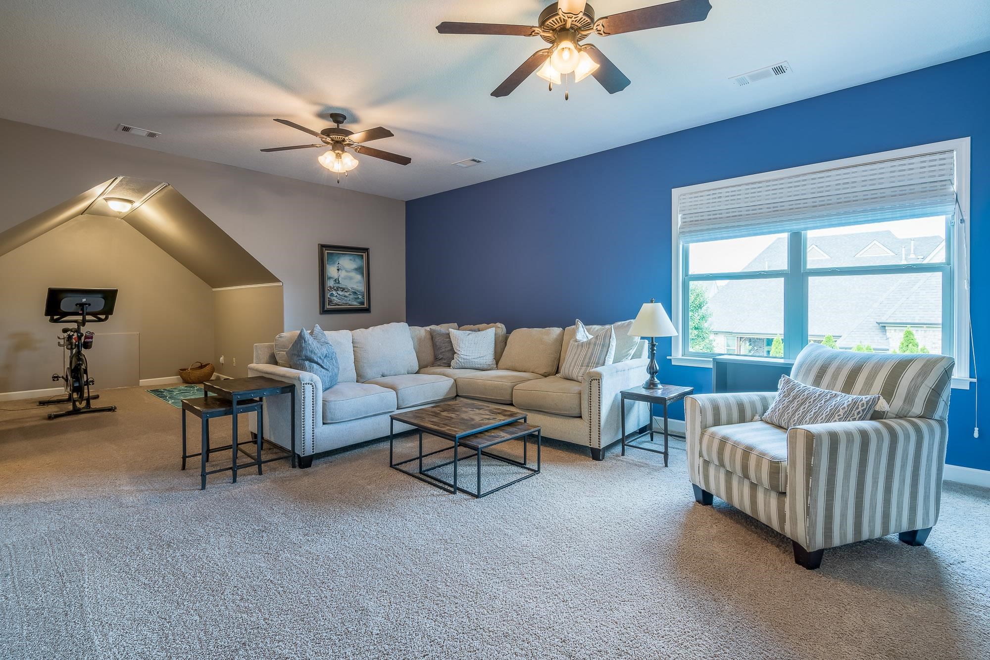 1347 Conser Street Collierville, TN 38017 - Photo 18 of 25 a living room with furniture and a large window