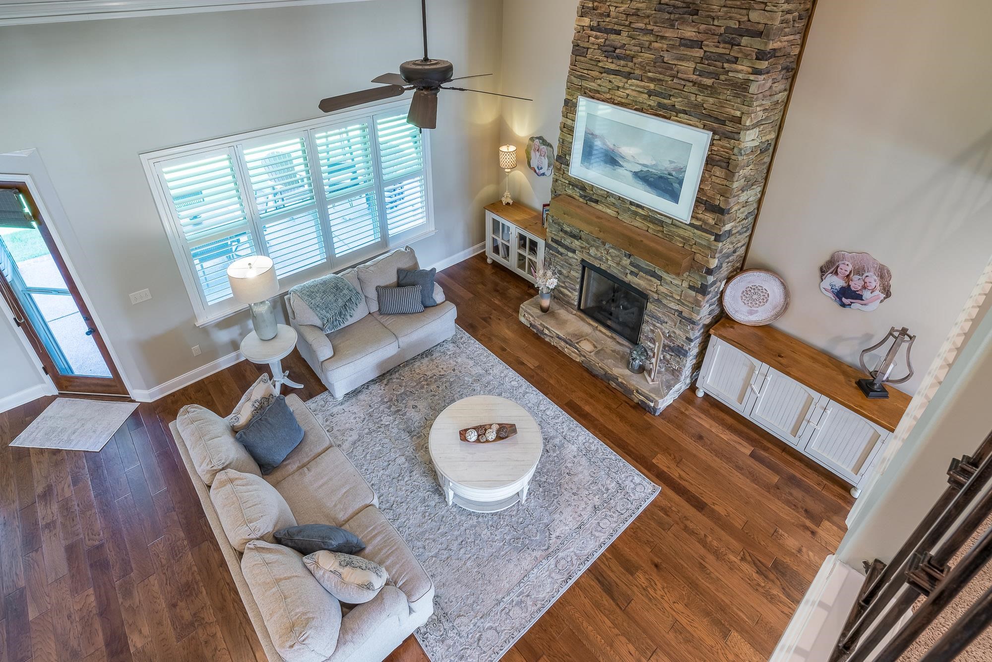 1347 Conser Street Collierville, TN 38017 - Photo 19 of 25 a living room with furniture and a fireplace