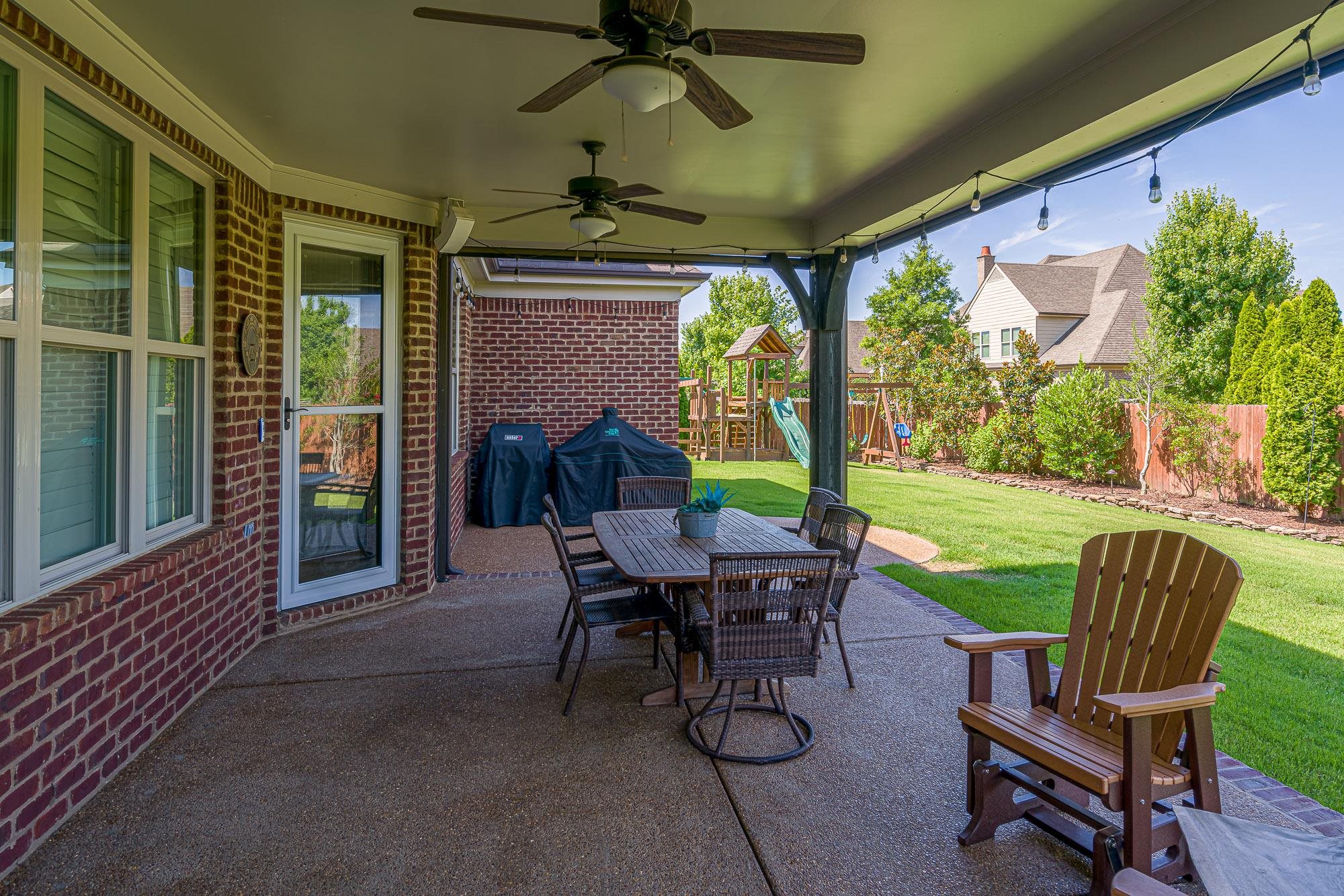 1347 Conser Street Collierville, TN 38017 - Photo 20 of 25 a view of a porch with furniture and a yard