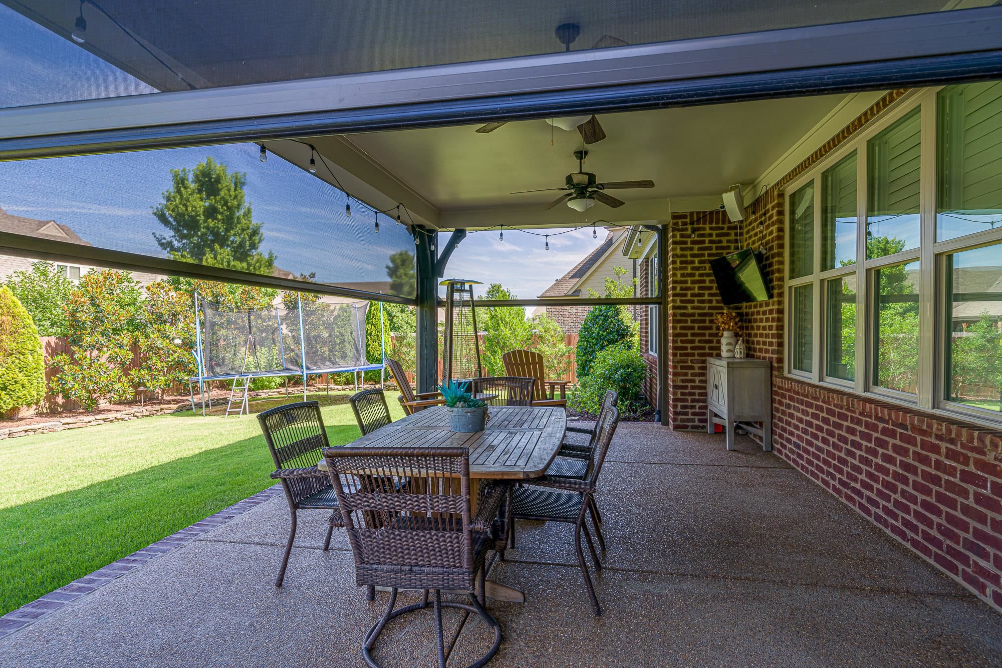 1347 Conser Street Collierville, TN 38017 - Photo 21 of 25 a view of a patio with a table chairs and a backyard