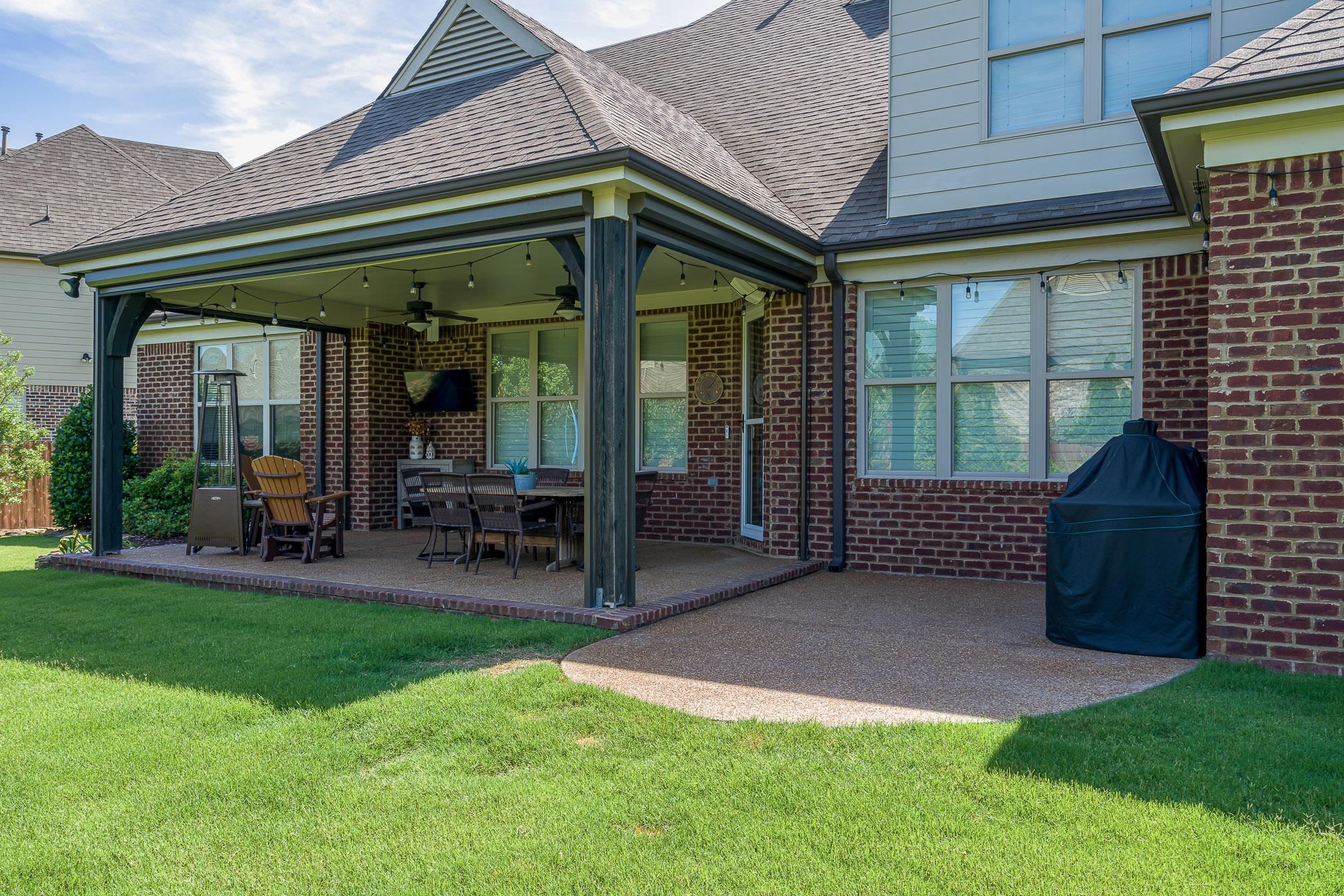 1347 Conser Street Collierville, TN 38017 - Photo 23 of 25 a view of a house with a garden and porch