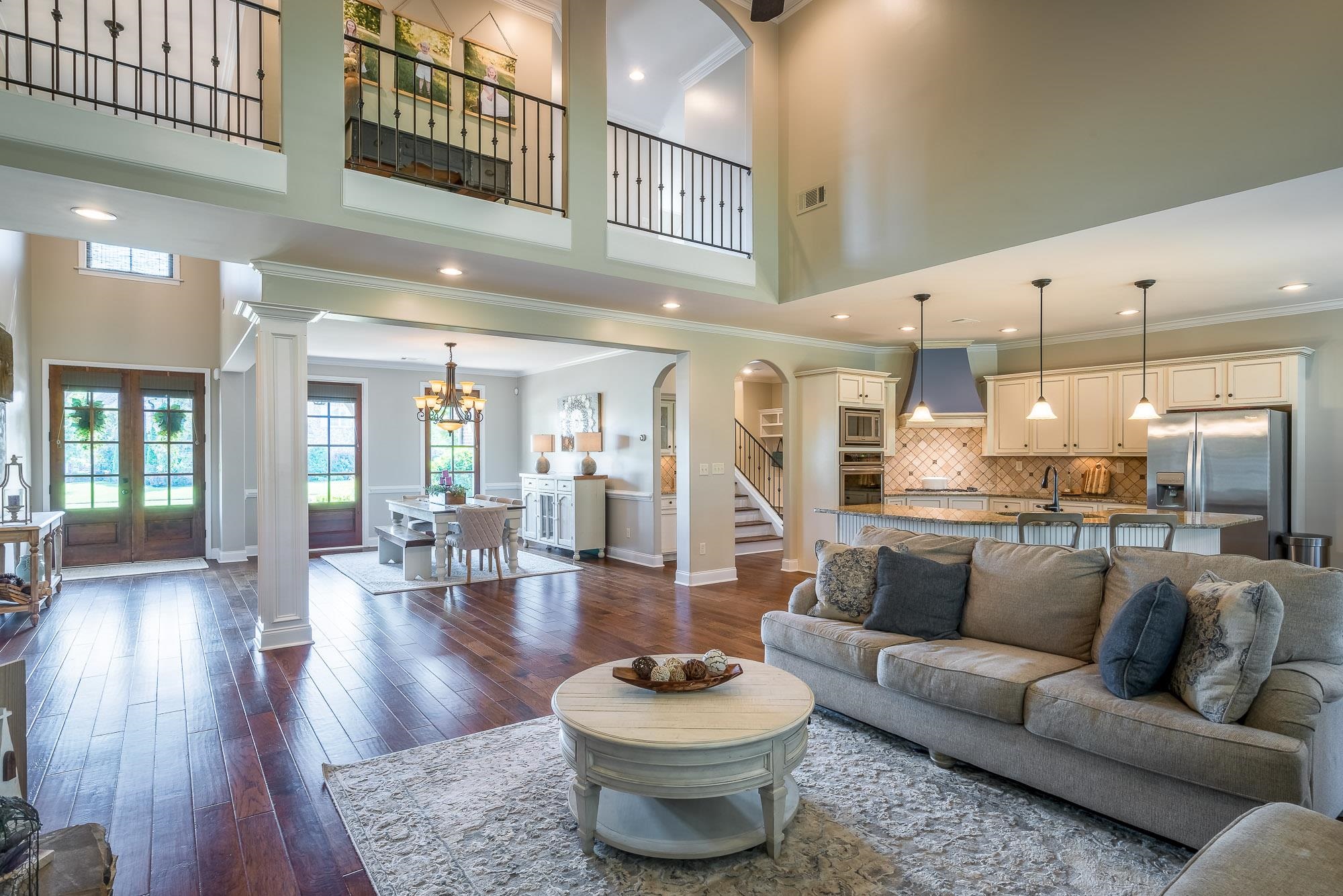 1347 Conser Street Collierville, TN 38017 - Photo 3 of 25 a living room with furniture a rug and kitchen view