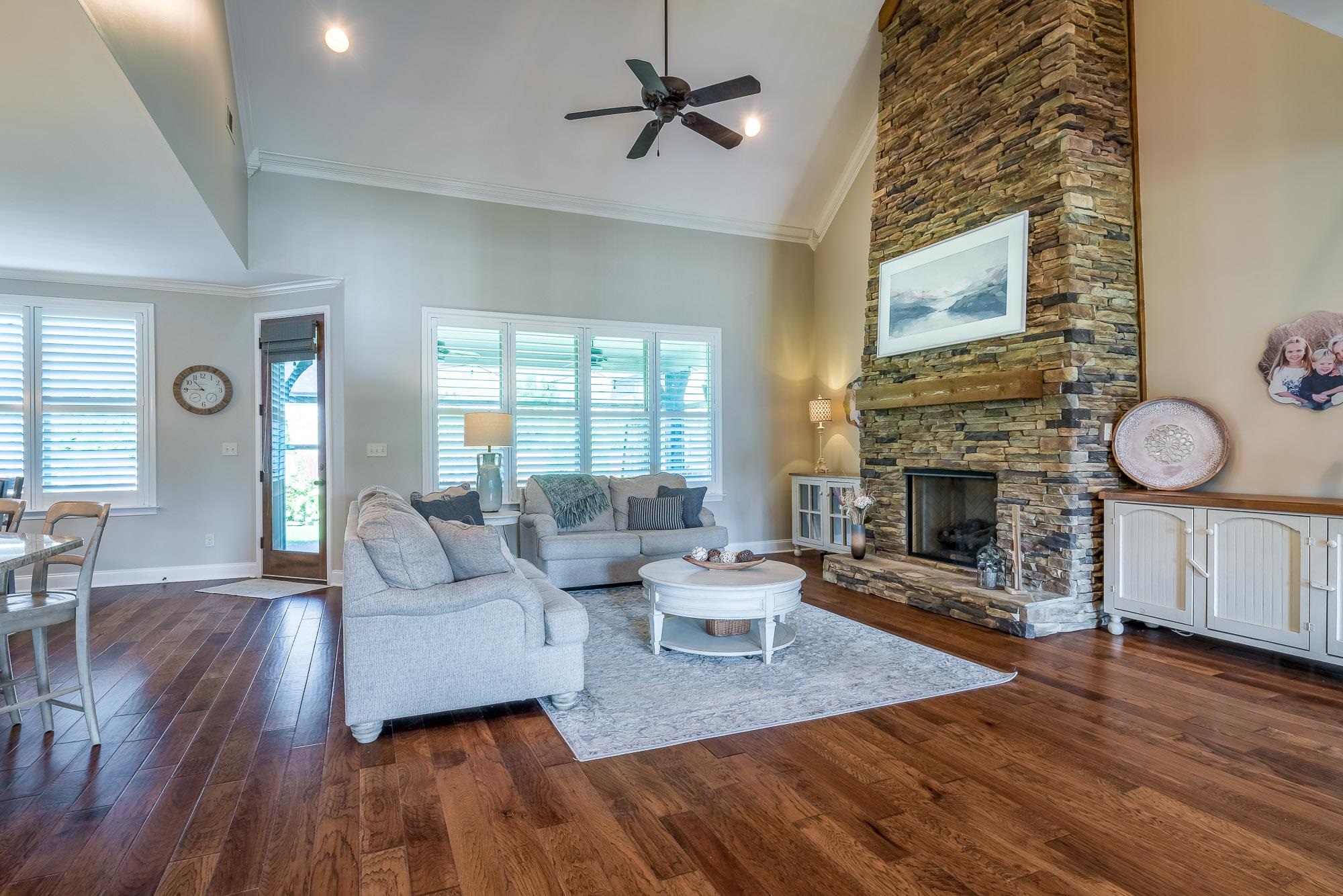 1347 Conser Street Collierville, TN 38017 - Photo 4 of 25 a living room with furniture a fireplace and a table