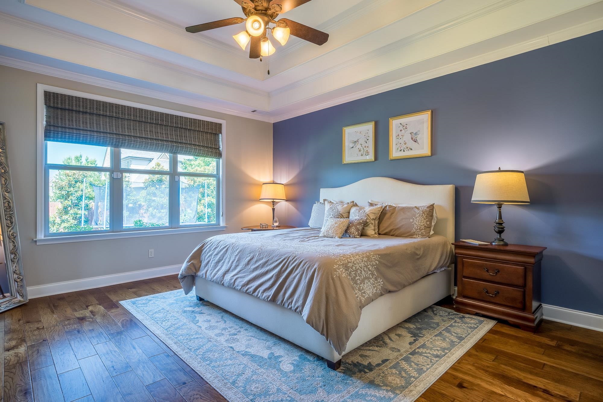 1347 Conser Street Collierville, TN 38017 - Photo 10 of 25 a bedroom with a large bed and a lamp