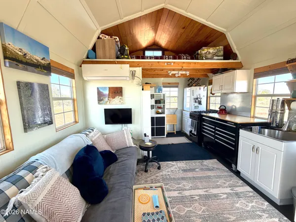 a kitchen view of a stove and wooden floor