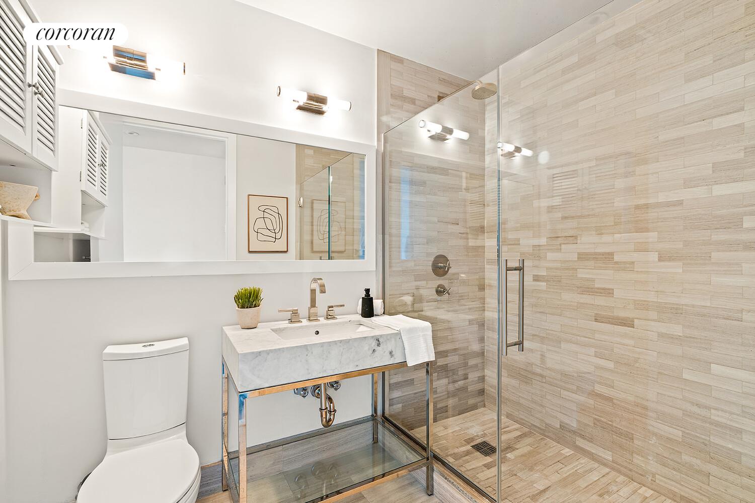 250 West Street, Unit 8H Manhattan, NY 10013 - Photo 13 of 16 a bathroom with a sink toilet and shower