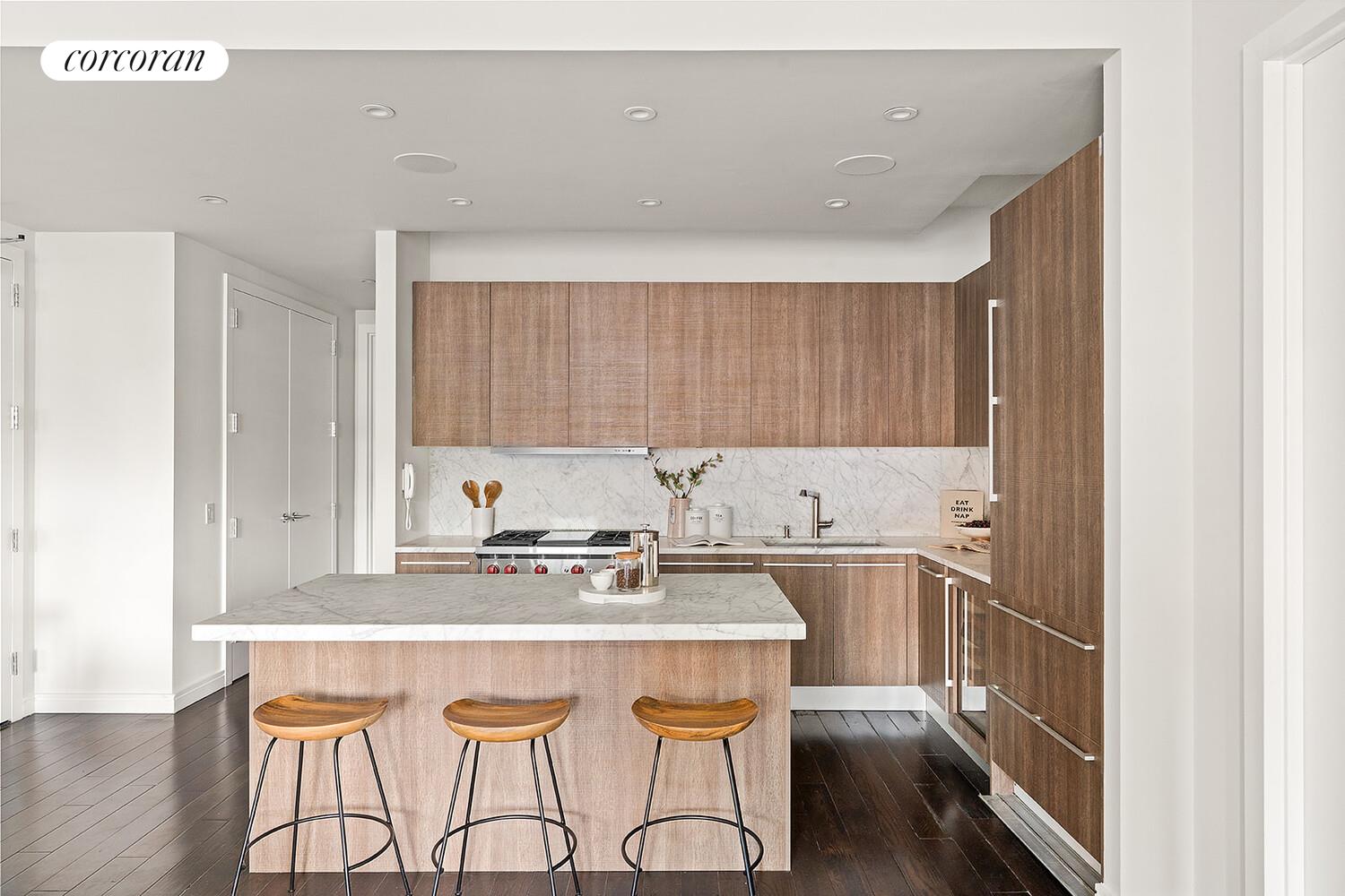 250 West Street, Unit 8H Manhattan, NY 10013 - Photo 3 of 16 a kitchen with a sink a stove cabinets and wooden floor