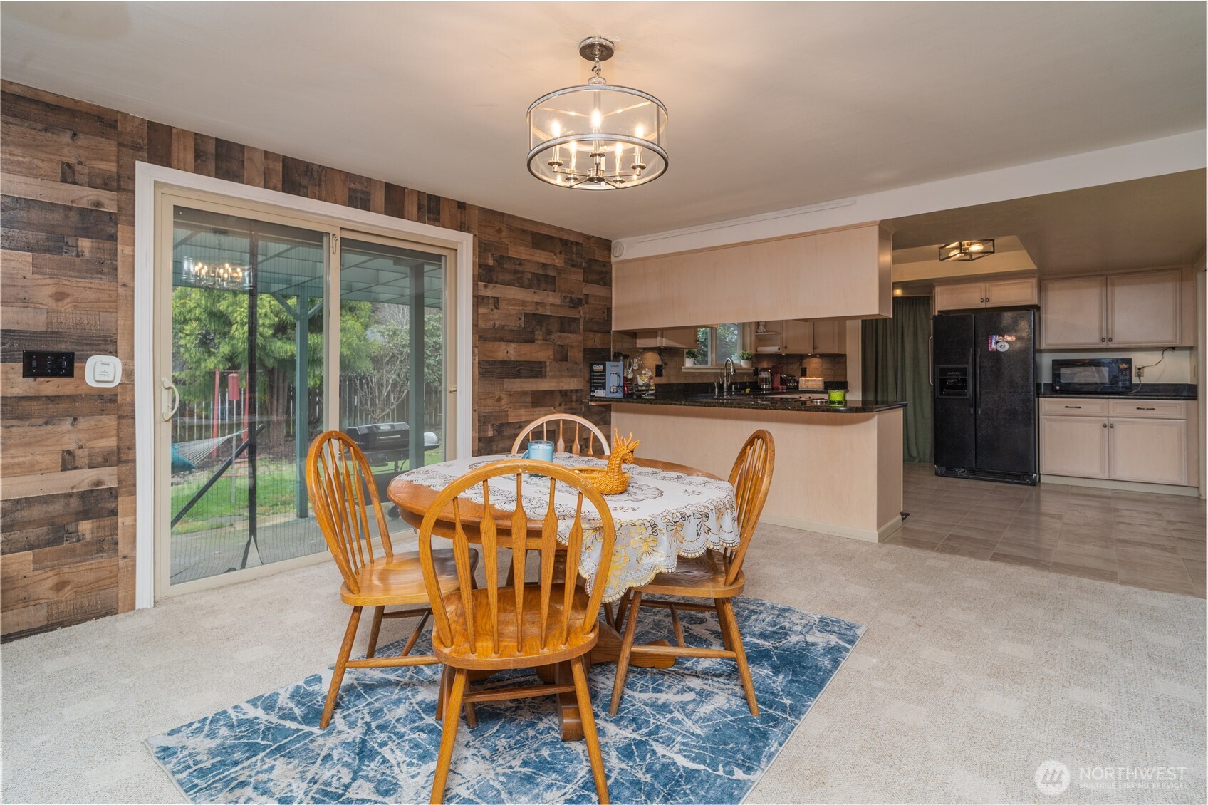 1215 Dundee Drive Cosmopolis, WA 98537 - Photo 12 of 30 a dining room with furniture a chandelier and window