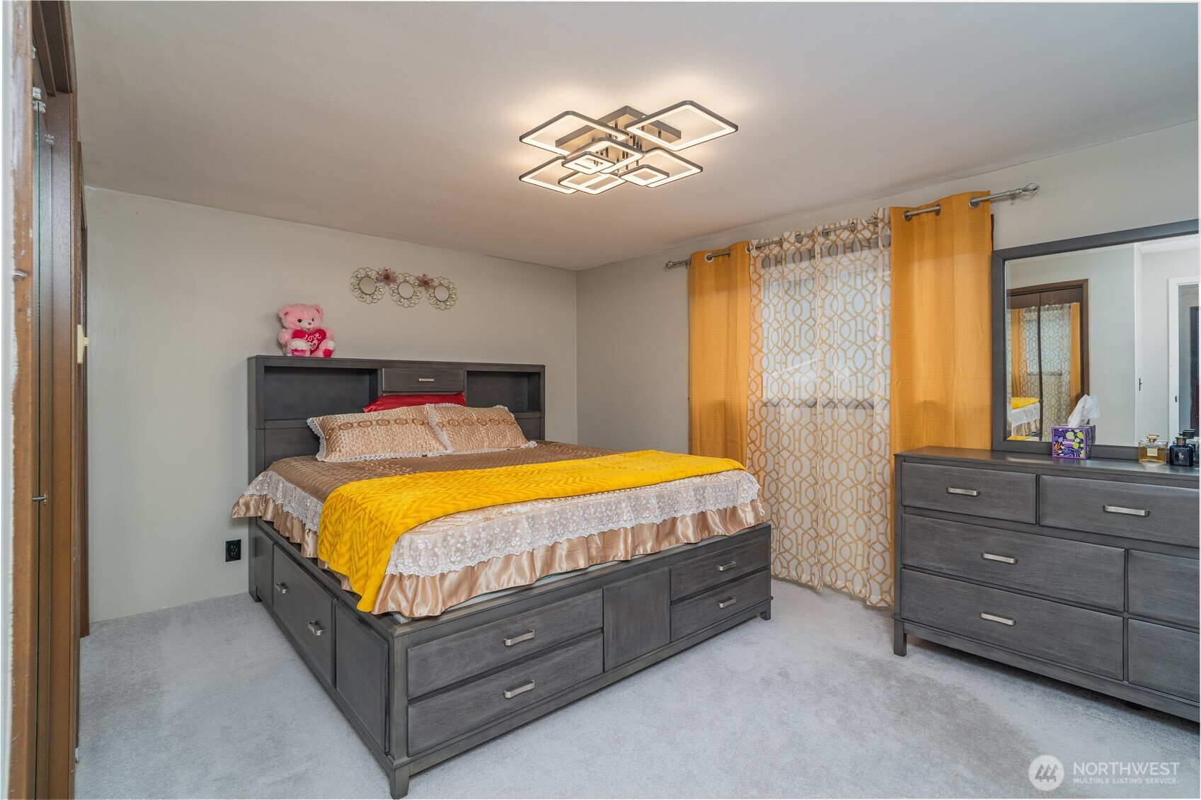 1215 Dundee Drive Cosmopolis, WA 98537 - Photo 20 of 30 a bedroom with a bed and a chandelier