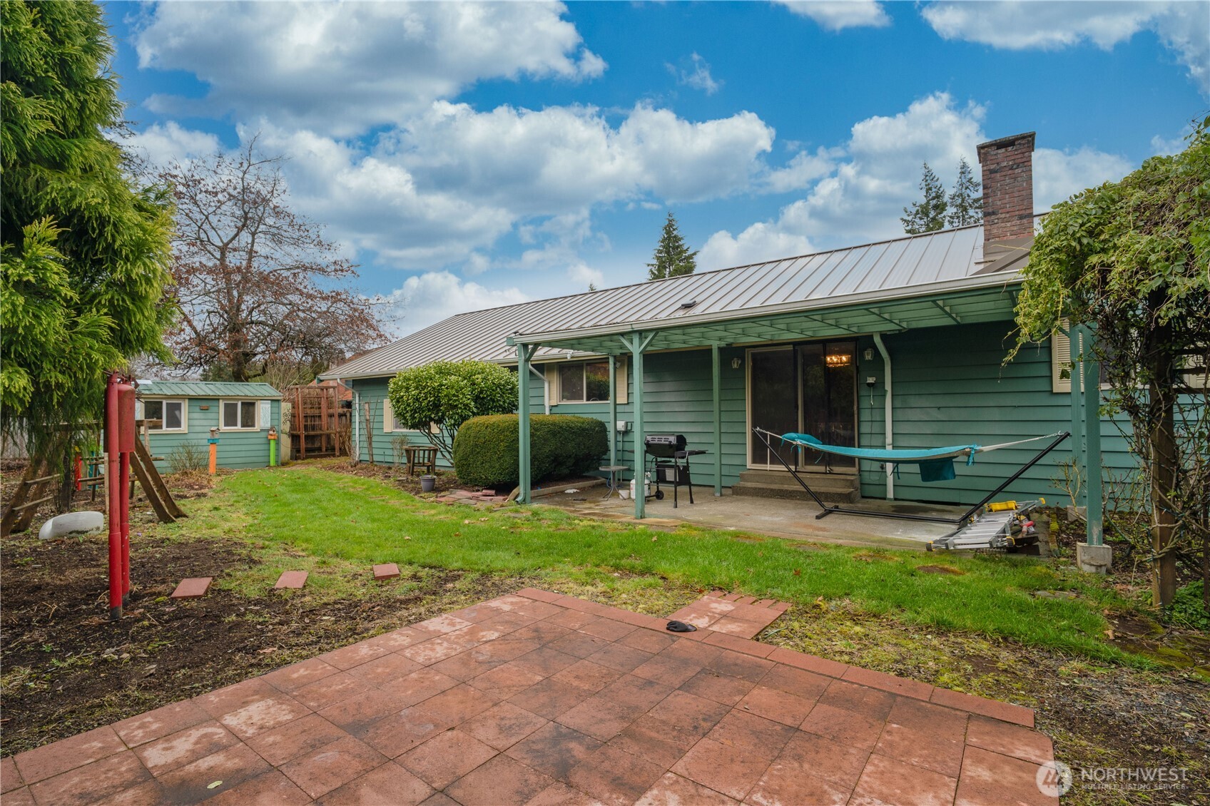 1215 Dundee Drive Cosmopolis, WA 98537 - Photo 30 of 30 a view of a house with backyard sitting area and garden