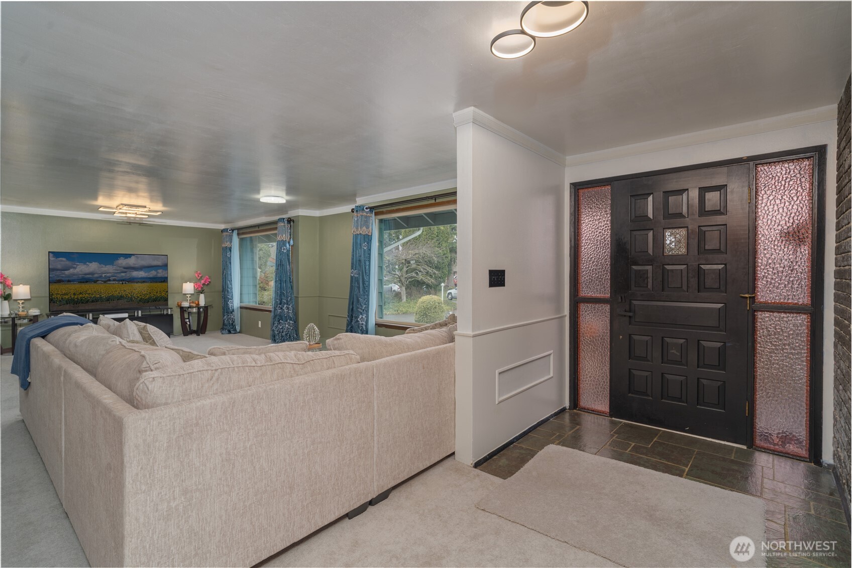 1215 Dundee Drive Cosmopolis, WA 98537 - Photo 7 of 30 a living room with furniture and a flat screen tv