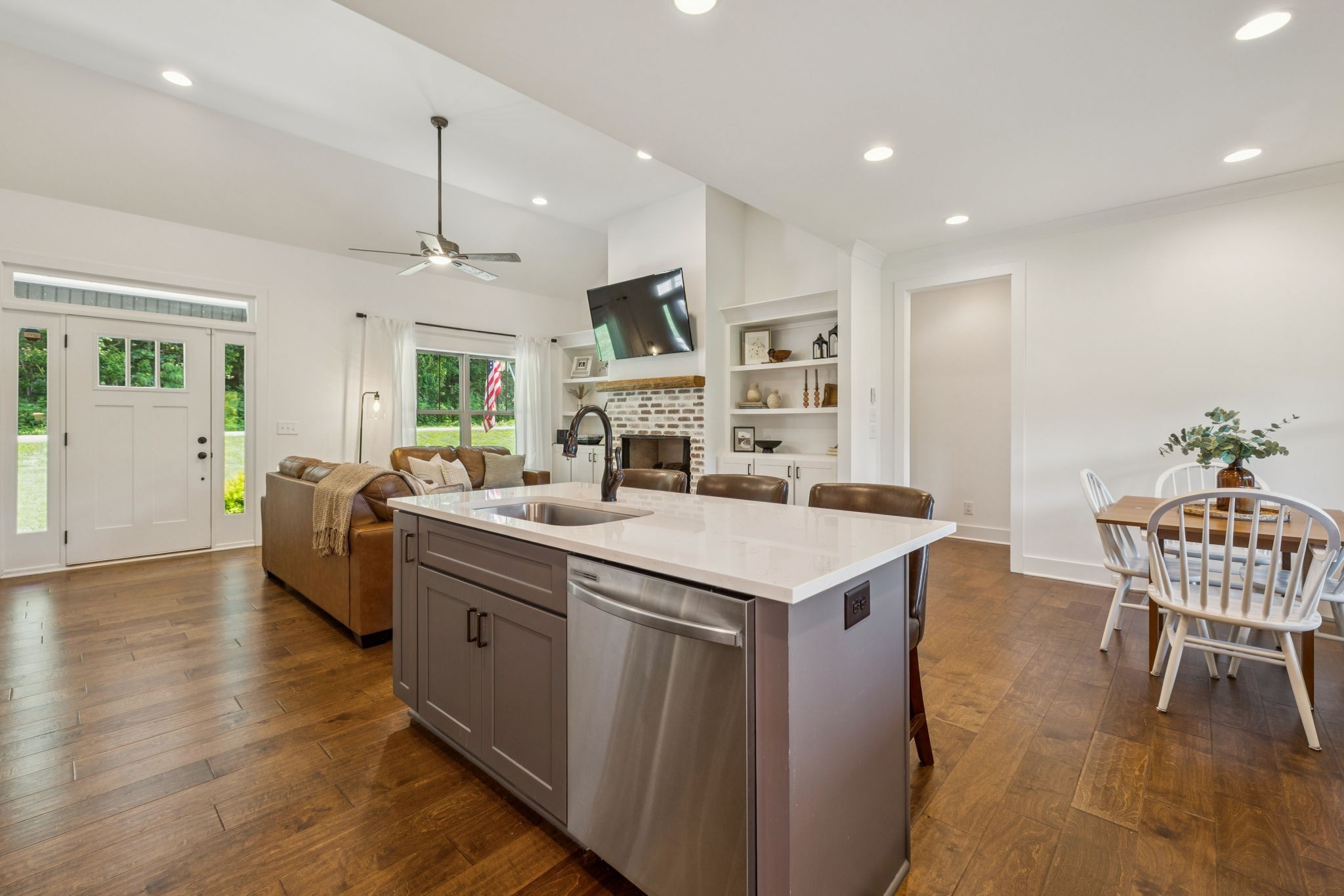 760 Johnson Hollow Road Watertown, TN 37184 - Photo 11 of 53 a kitchen with a table chairs refrigerator and cabinets