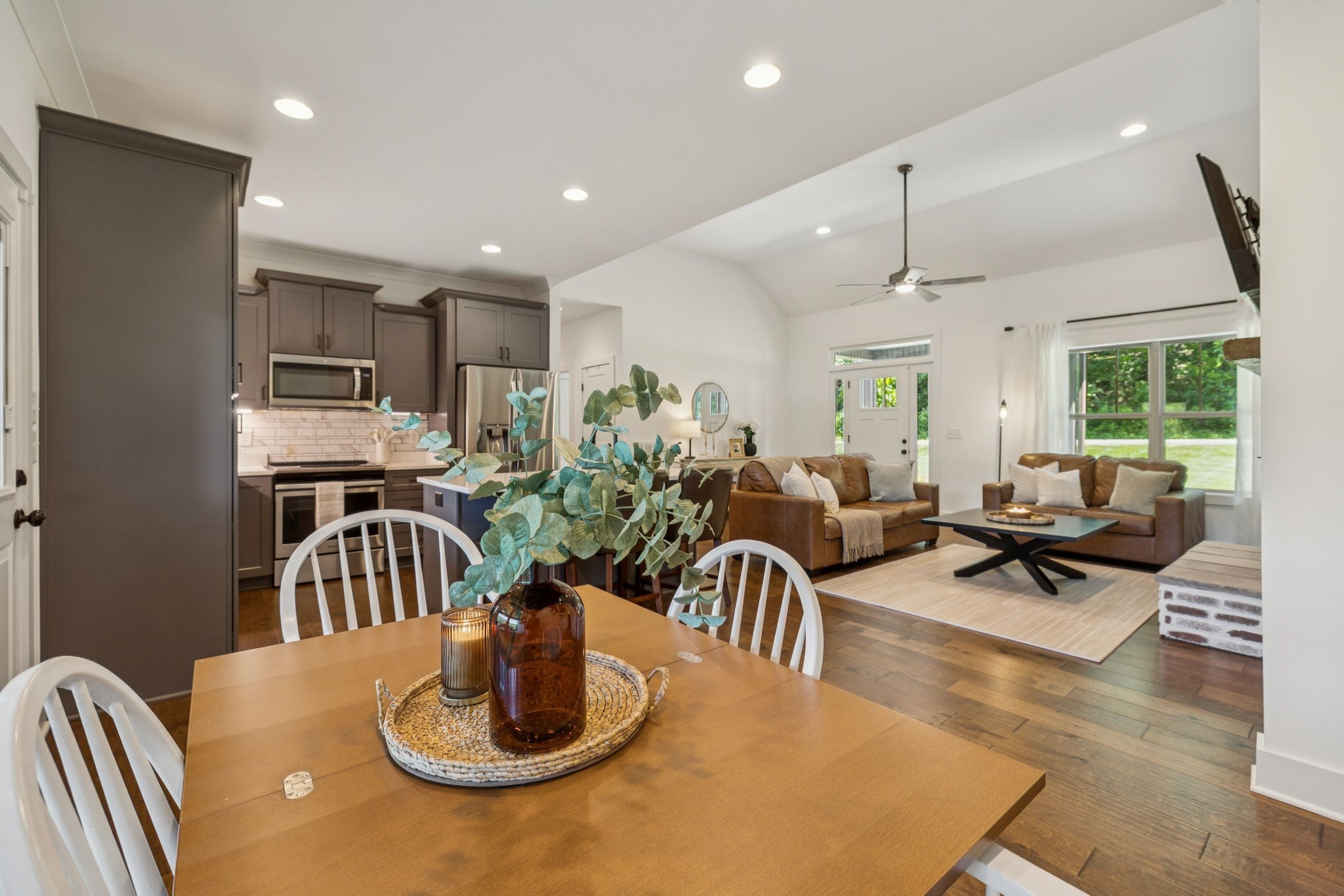 760 Johnson Hollow Road Watertown, TN 37184 - Photo 12 of 53 a living room with kitchen island furniture and a wooden floor