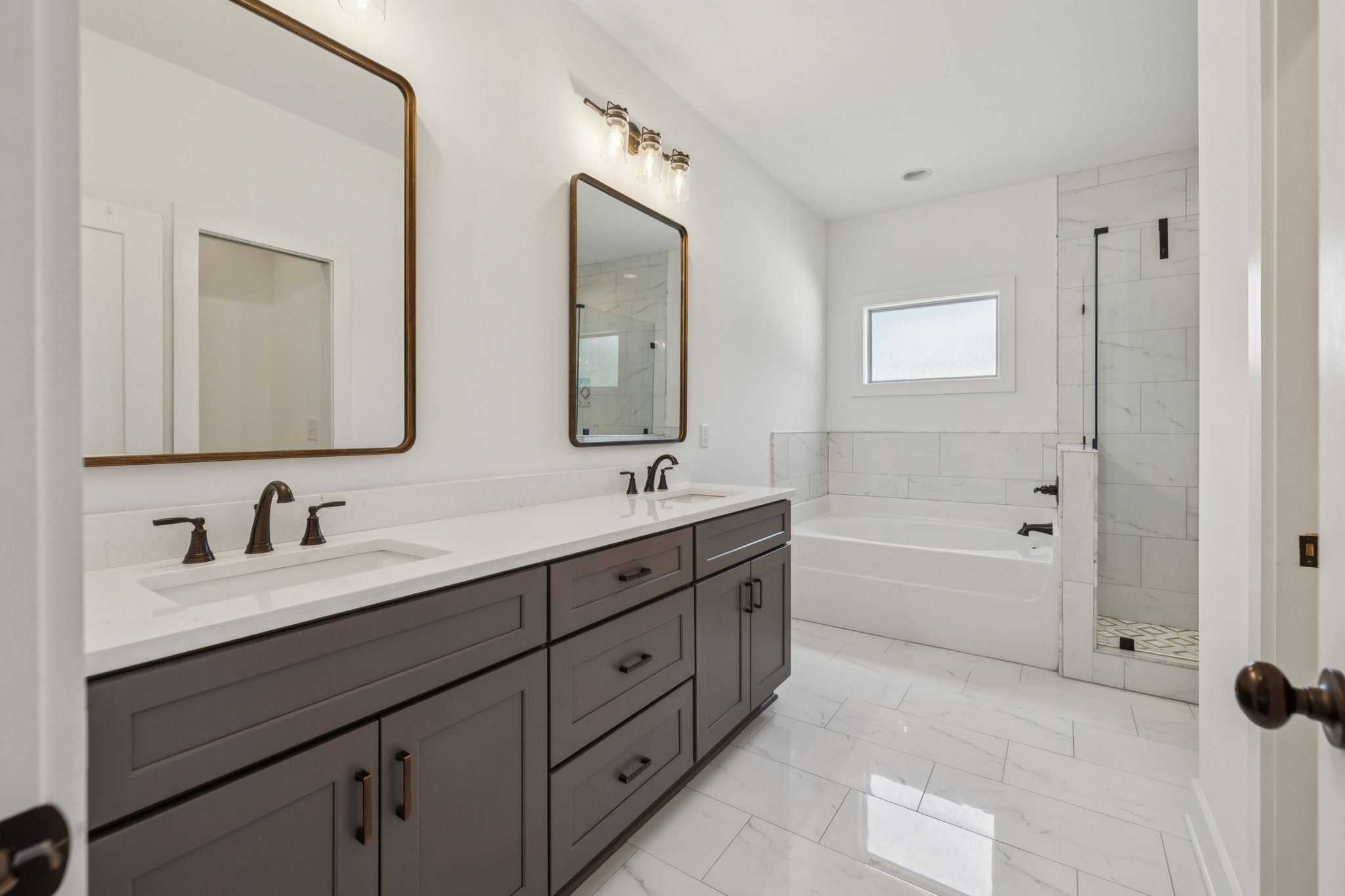 760 Johnson Hollow Road Watertown, TN 37184 - Photo 17 of 53 a bathroom with double vanity sinks double vanity tub and a mirror